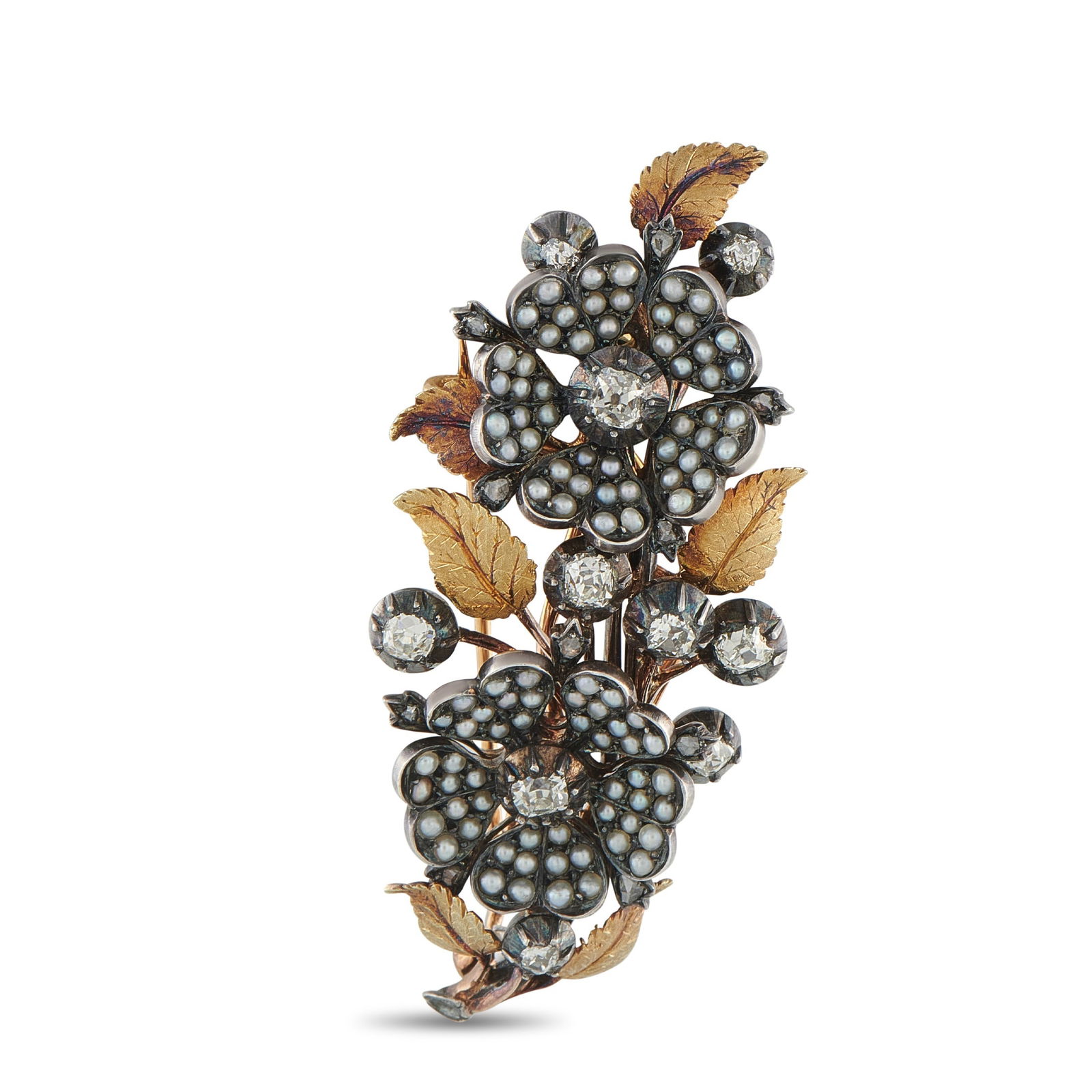 Antique French 18K Rose Gold 1.20ct Diamond and Seed Pearl Brooch: Timeless floral motifs make this antique French brooch simply exquisite. Seed Pearls provide a subtle touch of luxury, while Peruzzi cut Diamonds with a total weight of 1.20 carats add vintage