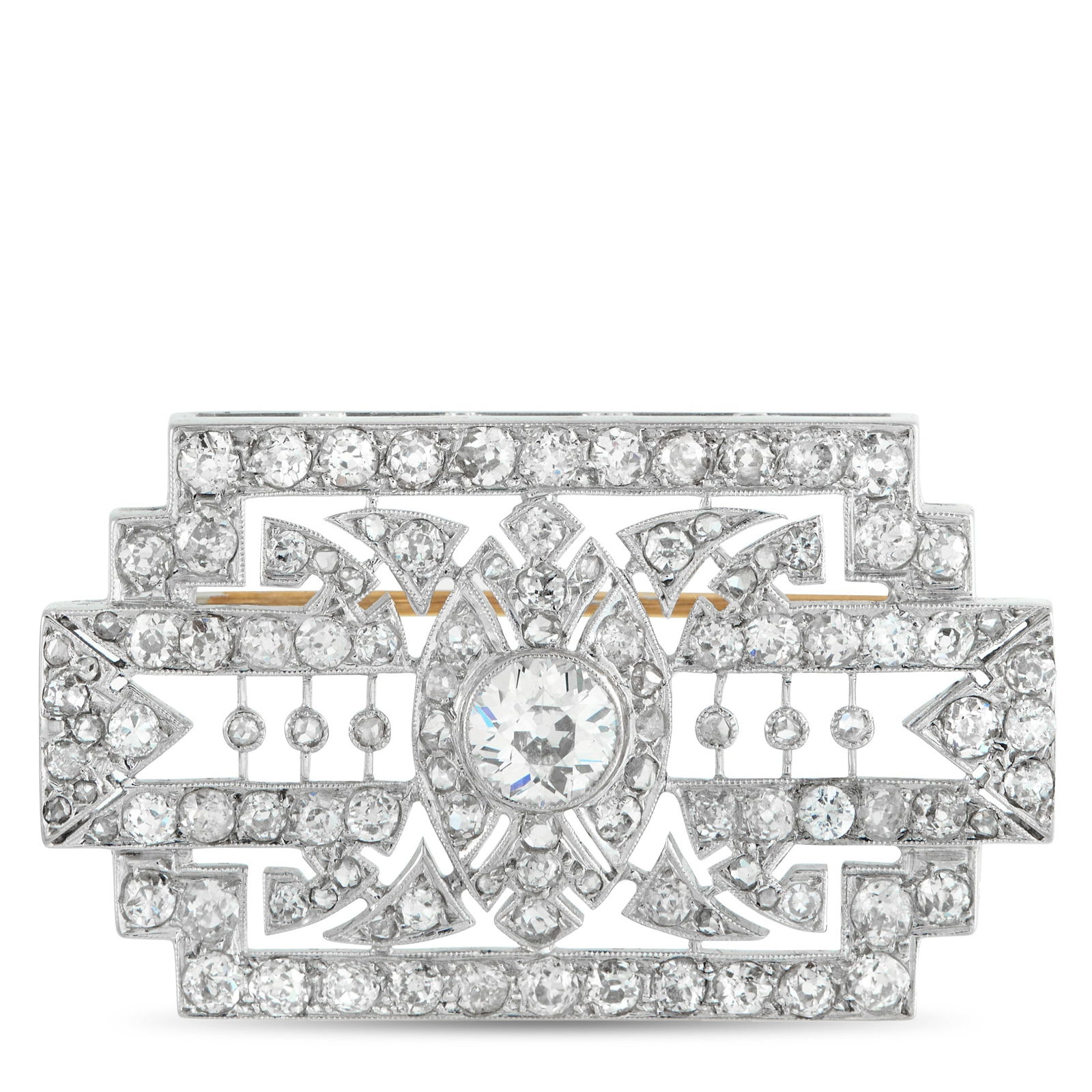 Platinum 3.70ct Diamond Art Deco Brooch: In this piece, geometric panels and linear segments are dotted with diamonds totaling 2.70 carats, each placed to emphasize the structure of the Art Deco design. At the center, a larger 1.0-carat roun