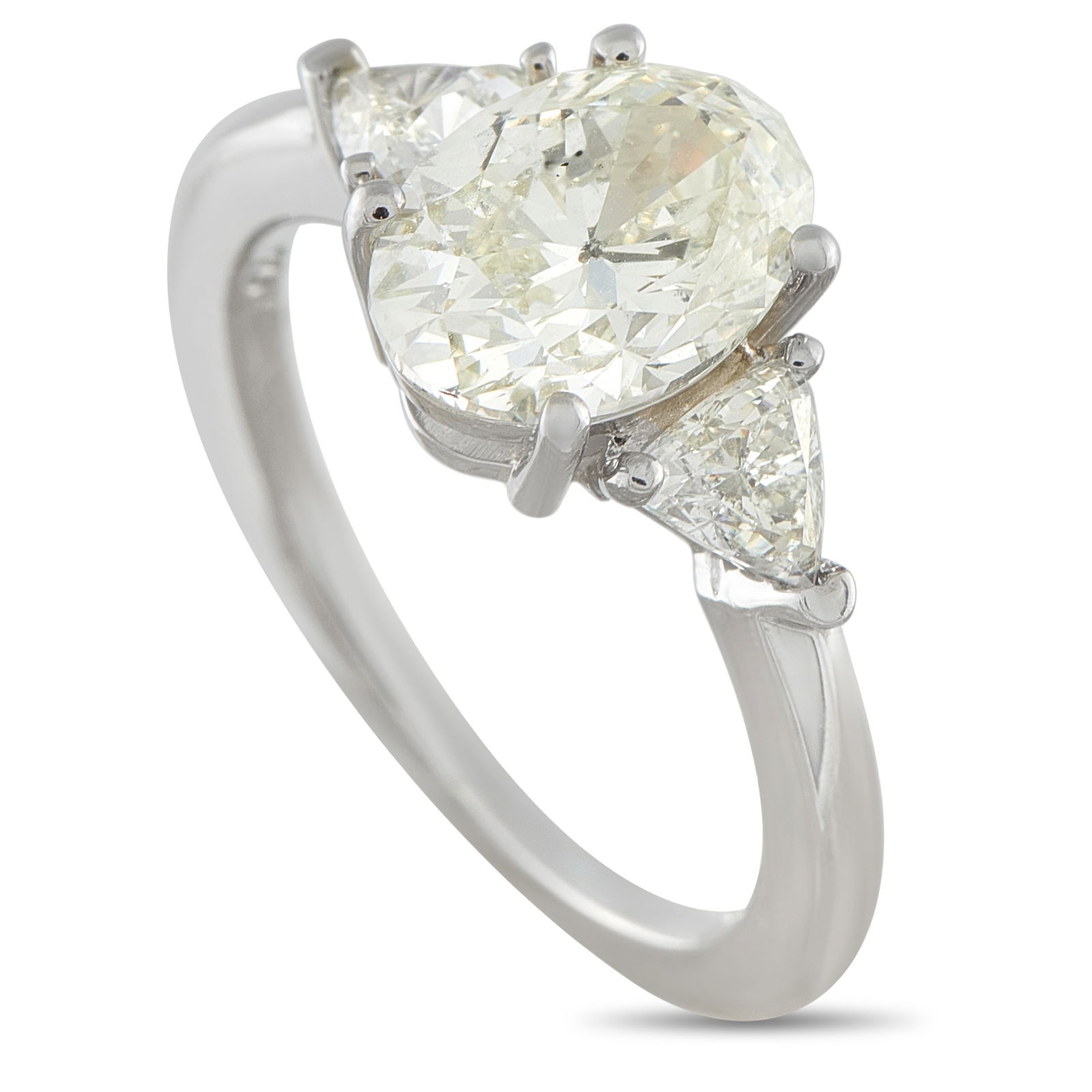 Platinum 2.41ct Diamond Three-Stone Ring: Three stones, three markers in time. Said to be a past, present, and future ring, this piece has its symbolism clear. At the center sits a 2.01 carat oval diamond, J color, SI1 clarity, secured by fou