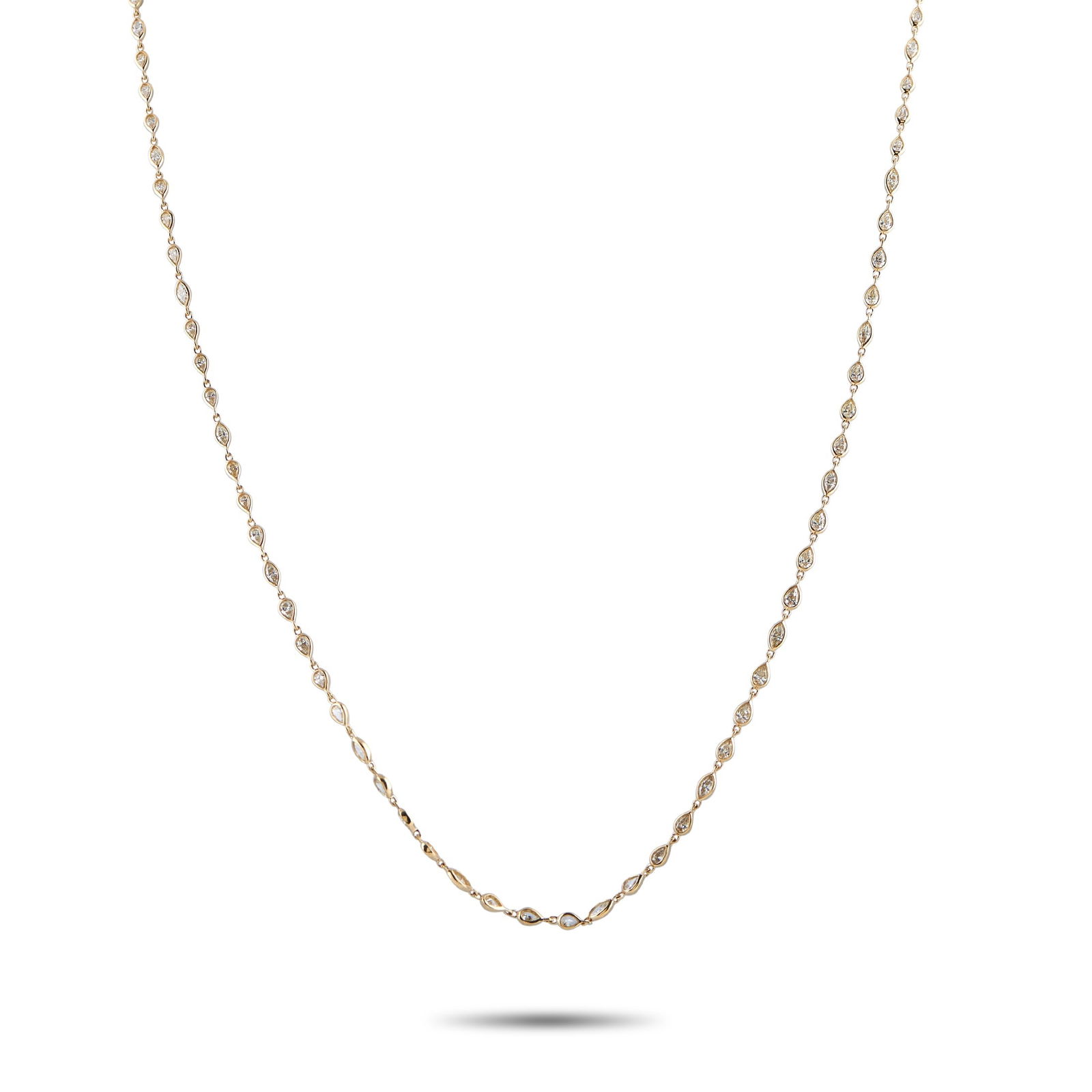 18K Yellow Gold 7.25ct Diamond Teardrop Line Necklace: A 32-inch chain in yellow gold, built from petite teardrop links with the occasional marquise shape for contrast. Each link is set with a diamond, sitting in an open-back setting that invites light