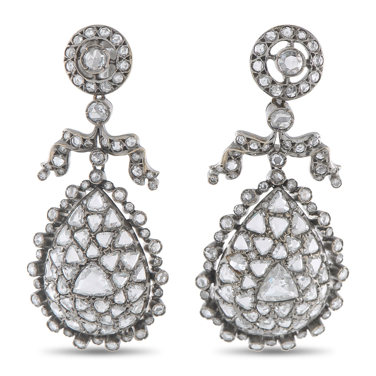 Fred Leighton18K White Gold 8.37ct Diamond Earrings: Incredibly ornate, these Fred Leighton earrings feature a classically elegant design that will continually captivate. Every dynamic detail is elevated by inset Diamonds totaling 8.37 carats. Set in 18
