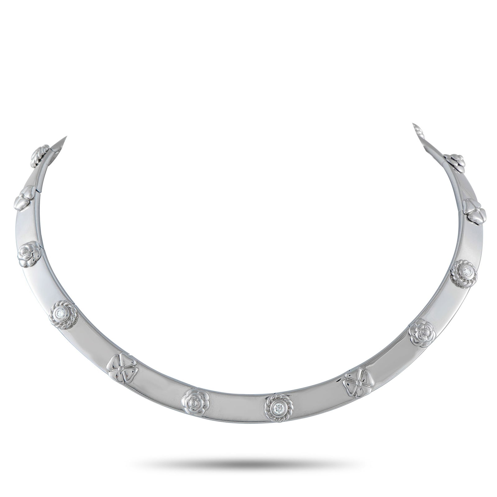 Chanel Three Symbols 18K White Gold Necklace: A striking design makes this Chanel Three Symbols necklace impossible to ignore. Sleek and stylish, it comes to life thanks to the four-leaf clover, camellia, and rosette symbols. Crafted from 18K Whi