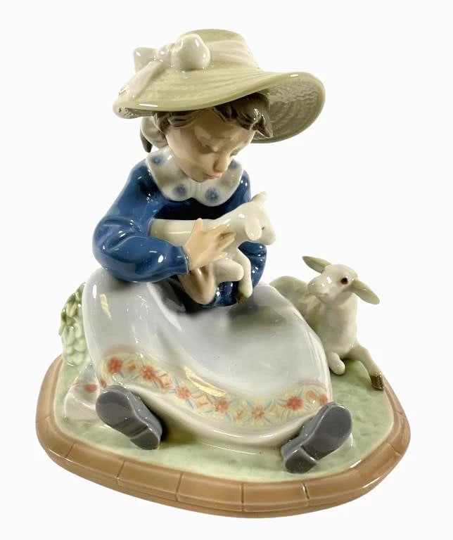 LLADRO LAMBKINS 1988-93 PORCELAIN FIGURINE 5469G: LLADRO LAMBKINS 1988-93 PORCELAIN FIGURINE 5469GLladro porcelain figurine titled Lambkins, model #5469, depicting a seated girl holding a lamb with another lamb resting nearby. Crafted in glossy porce