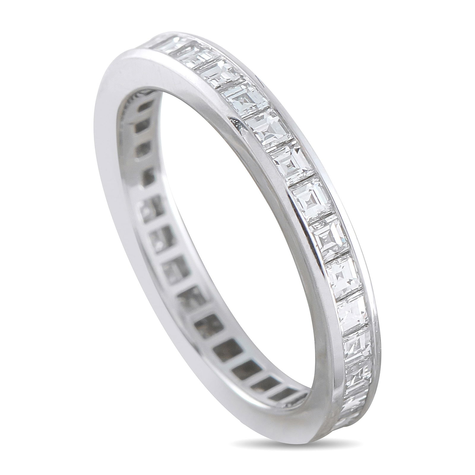 Tiffany & Co. Platinum 1.02ct Diamond Eternity Ring: This Tiffany & Co. eternity ring presents a full channel of square-cut diamonds encircling a slender 2mm platinum band, totaling 1.02 carats. The channel walls secure each stone edge to edge, forming