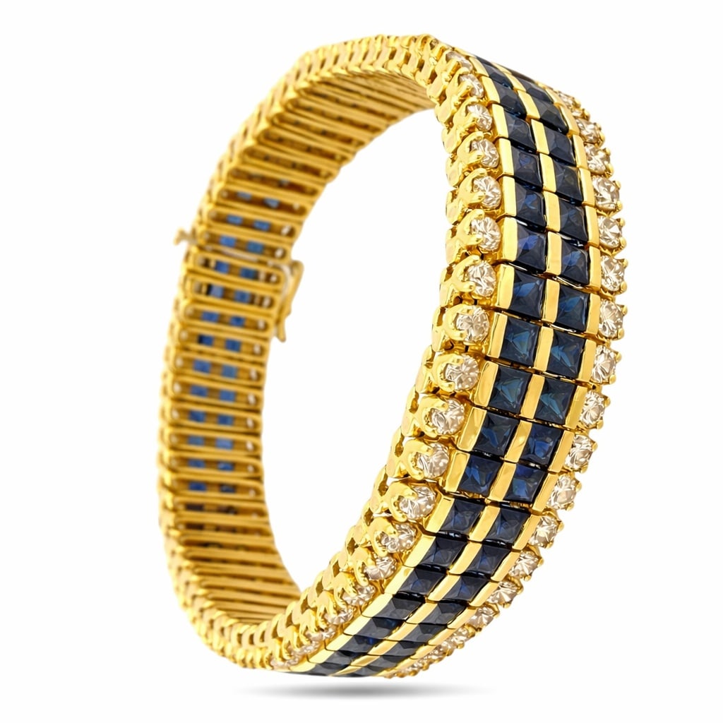 18 kt. Yellow gold, Exclusive 18K Yellow Gold 13.2ct Sapphire and 7.20ct Diamond 20.40ct. tw.: Exclusive 18K Yellow Gold 13.2ct Sapphire and 7.20ct Diamond BraceletThis bracelet presents a refined sequence of polished gold links, each set with a matched pair of sapphires and diamonds that creat