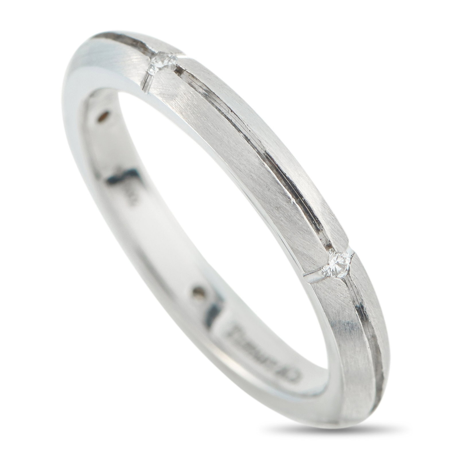 Tiffany & Co. - 18 kt. White gold, Tiffany & Co. 18K White Gold Diamond Band Ring: Tiffany & Co. 18K White Gold Diamond Band RingClean lines and inset diamonds make this Tiffany & Co. band ring incredibly sophisticated. Measuring 2mm wide, it will look elegant when stacked with othe