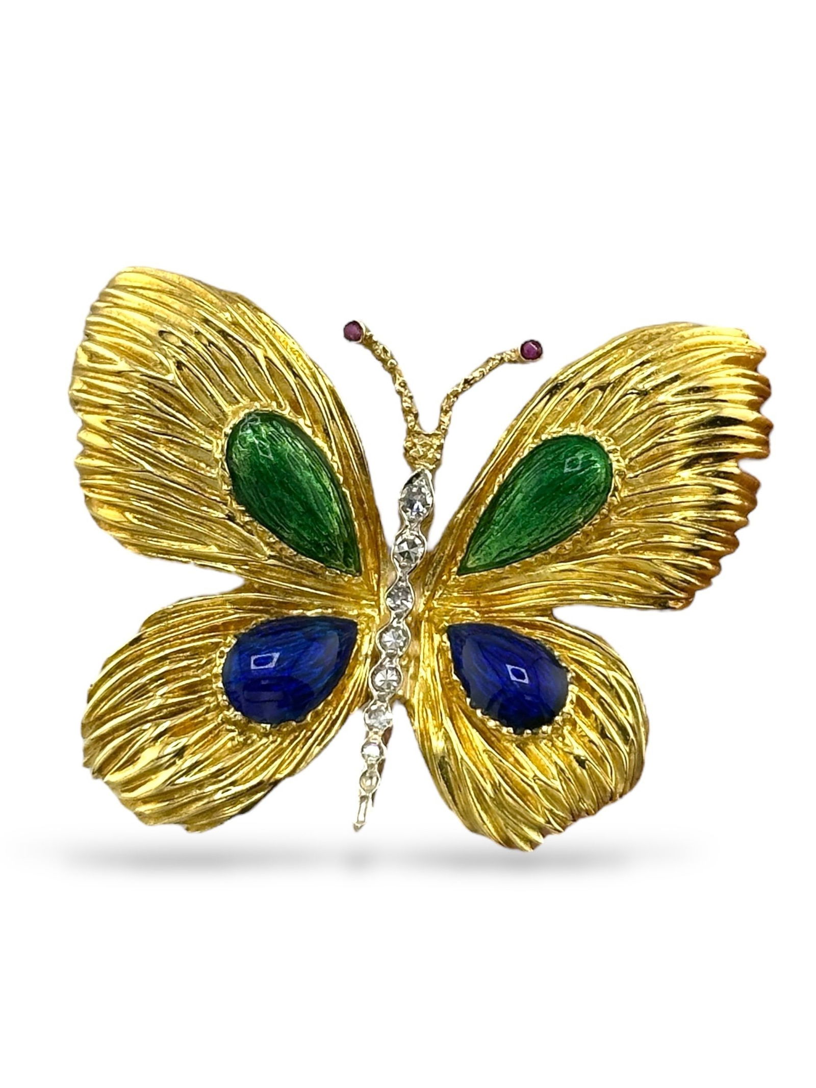 18 kt. Yellow gold, Exclusive Vintage 18K Yellow Gold Enamel, 0.17ct Diamond & Ruby Butterfly: Exclusive Vintage 18K Yellow Gold Enamel, 0.17ct Diamond & Ruby Butterfly BroochA beautifully sculpted vintage butterfly brooch crafted in rich 18 karat yellow gold. The delicately fluted wings are ad