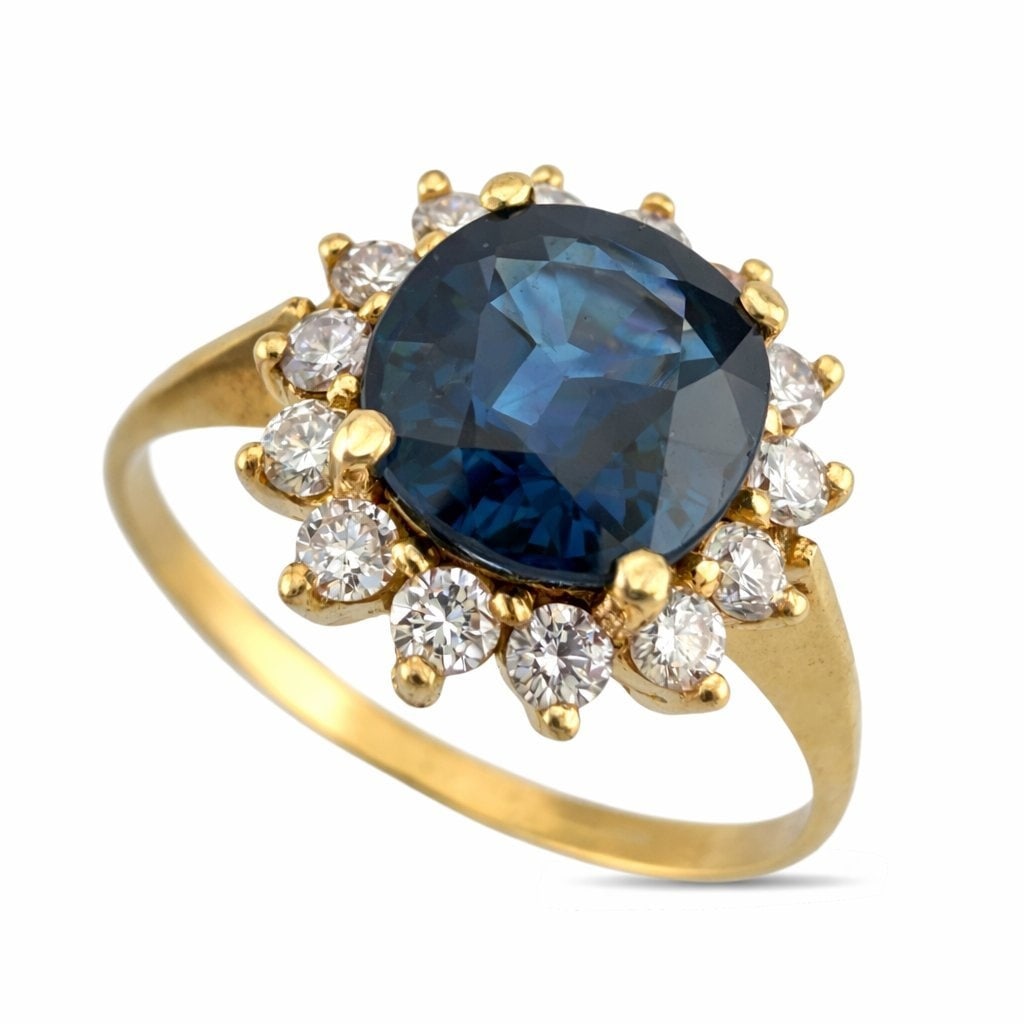 14K Yellow Gold 2.25ct Teal Sapphire and 0.28ct Diamond Ring - 2.53ct. tw. Sapphire - Diamond: Exclusive 14K Yellow Gold 2.25ct Teal Sapphire and 0.28ct Diamond RingA graceful and vibrant design centered around a richly saturated teal blue sapphire, beautifully framed by delicate accent diamond