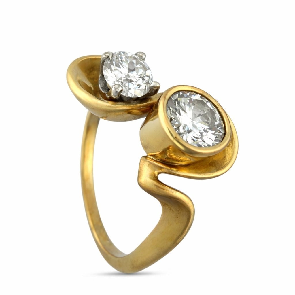 Vintage 14K Yellow Gold 1.0ct Diamond Swirl Ring - 1.0ct. tw. Diamond (Natural): Exclusive Vintage 14K Yellow Gold 1.0ct Diamond Swirl RingAn elegant vintage composition showcasing a graceful swirling silhouette that cradles two brilliant round diamonds in a dynamic, asymmetrical