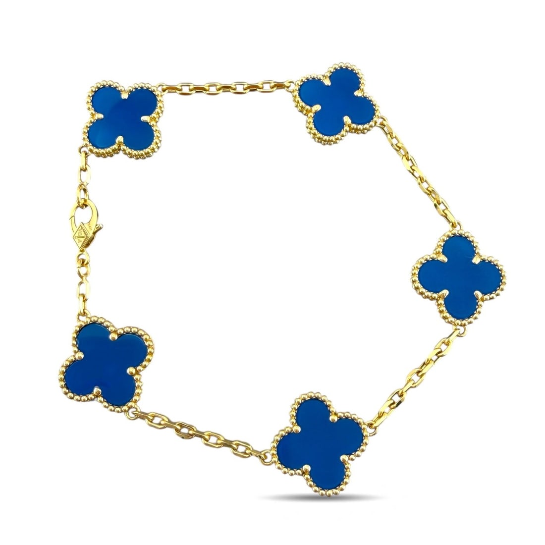Van Cleef & Arpels Alhambra Blue Agate Bracelet: Van Cleef & Arpels Vintage Alhambra Blue Agate Bracelet in 18 Karat Yellow GoldAn iconic and timeless creation from Van Cleef & Arpels, this Vintage Alhambra bracelet features five luminous blue agate