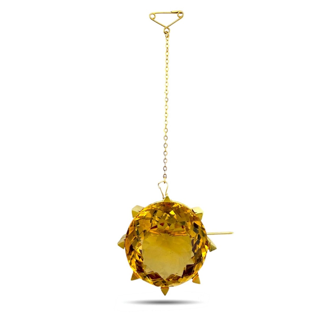 22K Yellow Gold Scottish Large Citrine Dynamic Polo Brooch Citrine: 22K Yellow Gold Scottish Large Citrine Dynamic Polo BroochThis detailed 22K yellow gold brooch captures a dynamic polo scene, featuring a rider in motion with a polo stick atop a galloping horse. The