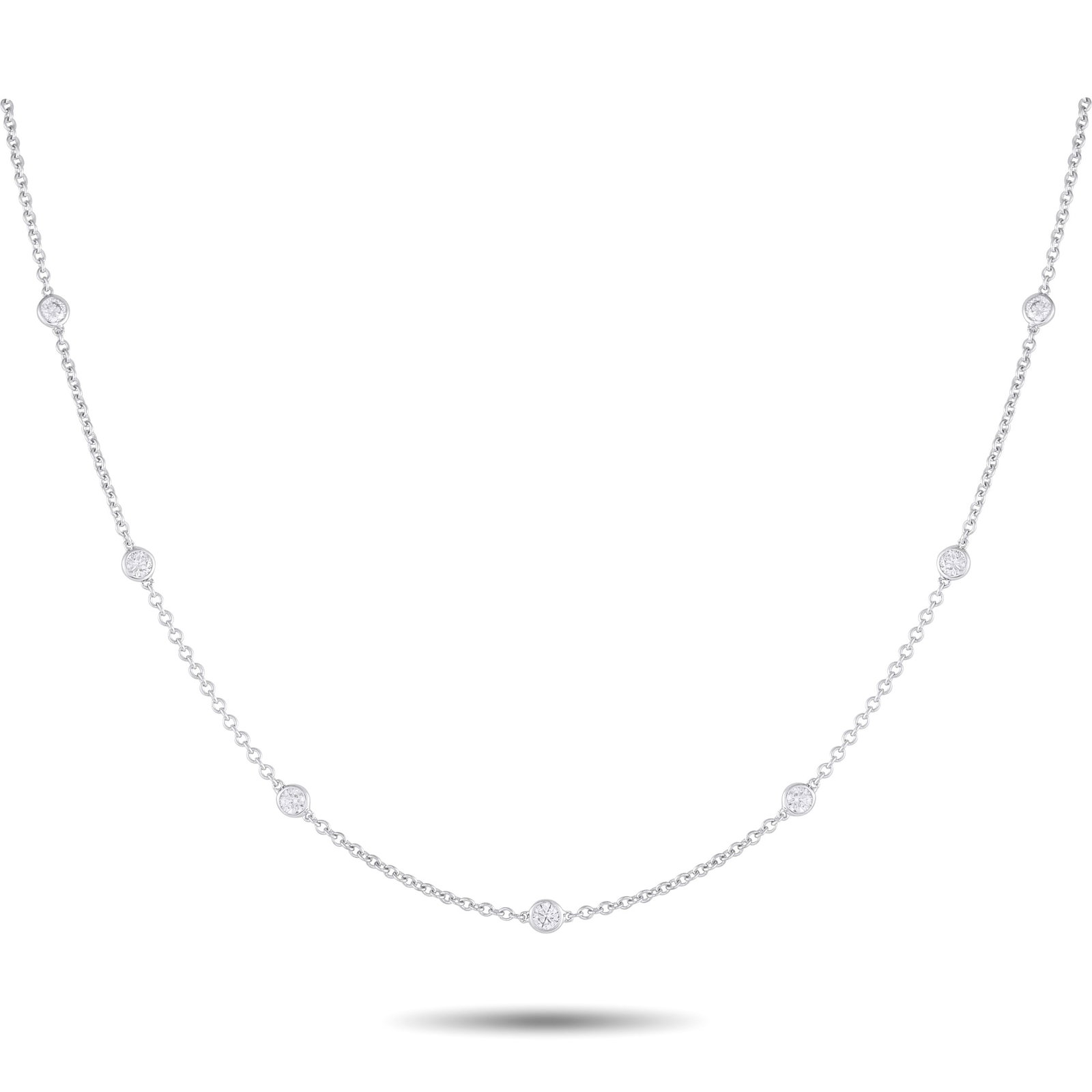 18K White Gold 0.75ct Diamond Station Necklace: This sophisticated necklace will make a subtle statement. Set in 18K White Gold, the delicate chain is elevated by a series of bezel set Diamonds totaling 0.75 carats. Ideal for everyday wear, this im
