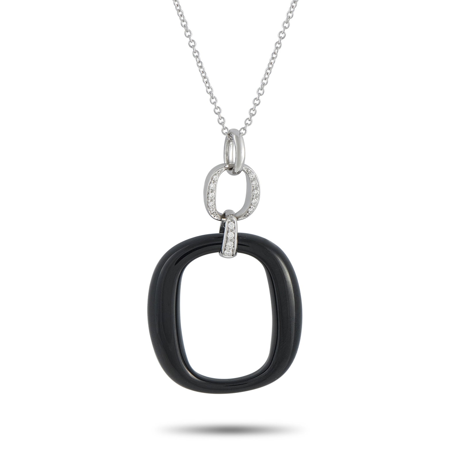 DAMIANI 18K White Gold Diamond and Onyx Necklace: A minimalist design gives this Damiani necklace a contemporary point of view. Suspended from a 19.5” chain, the dramatic pendant pairs black Onyx with sparkling inset Diamonds. The pendant is cr