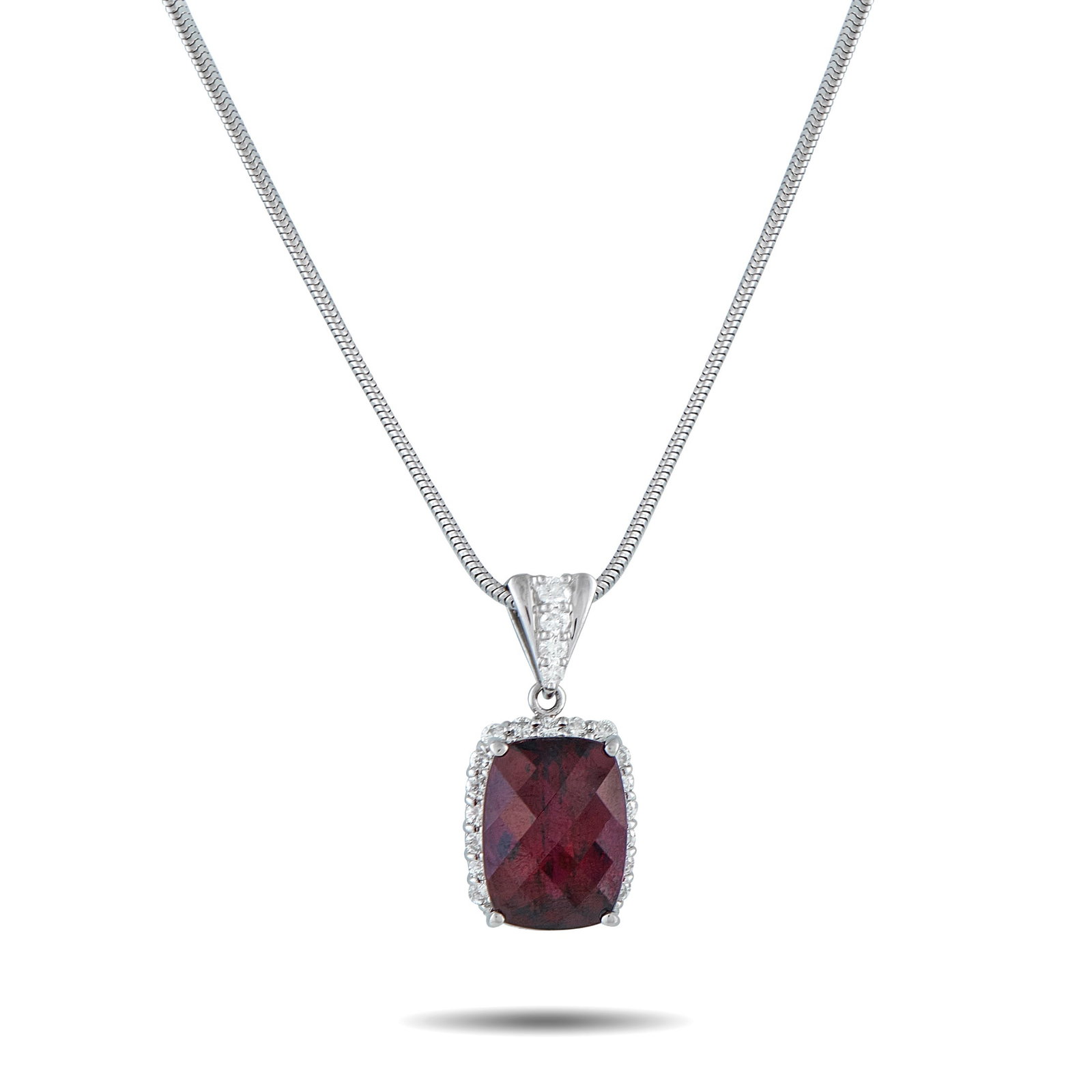 Platinum 0.80ct Diamond and Rhodolite Garnet Pendant: On this exquisite necklace, a 14.40 carat Rhodolite Garnet gemstone provides a stylish pop of color. Set in Platinum, the pendant measures 1.13” long by 0.50” wide and is suspended from a