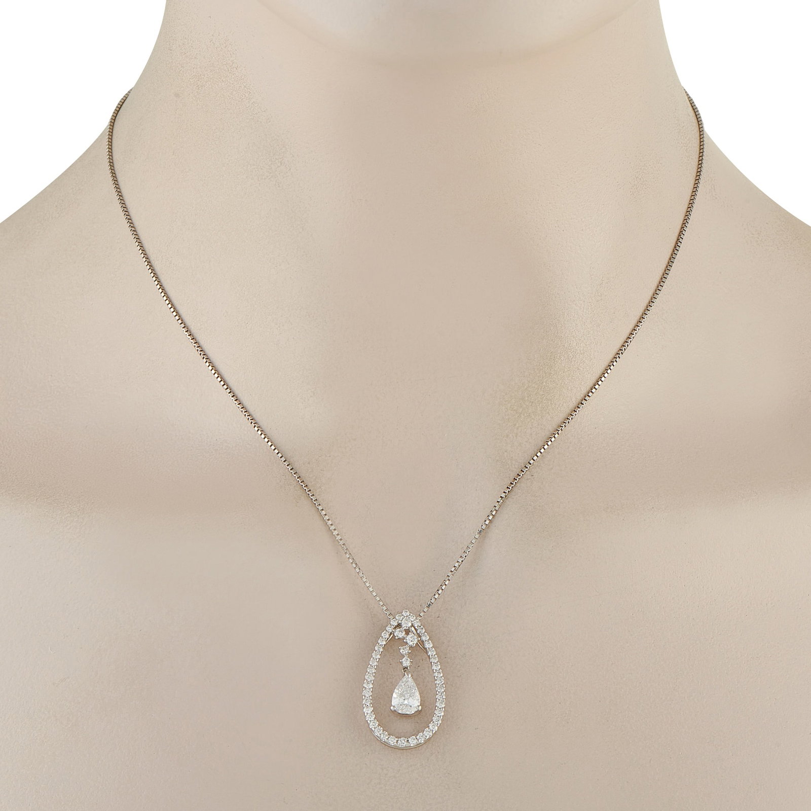 Platinum 1.67ct Diamond Teardrop Necklace: Seen here is a 1.01-carat pear-cut diamond hanging freely within a teardrop-shaped halo of smaller round diamonds. The soft movement and layers of sparkle give this necklace a charming appeal that’s