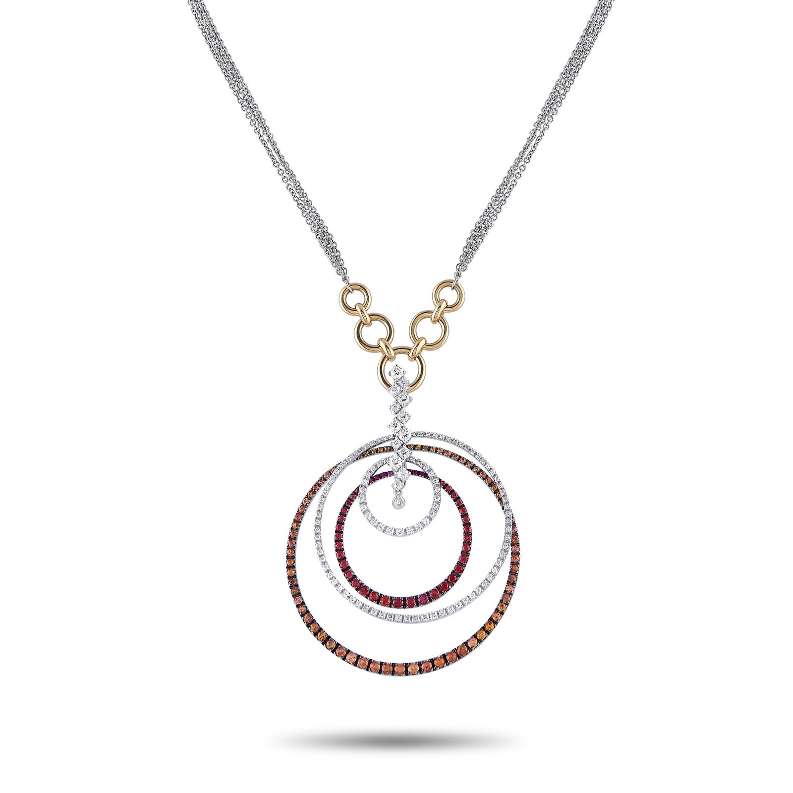 STAURINO FRATELLI 18K White and Yellow Gold 1.80ct Diamond and Sapphire Necklace: This Staurino Fratelli necklace combines traditional forms with contemporary elegance. The breathtaking pendant features concentric circles, colorful Sapphires totaling 3.30 carats, and a central arra