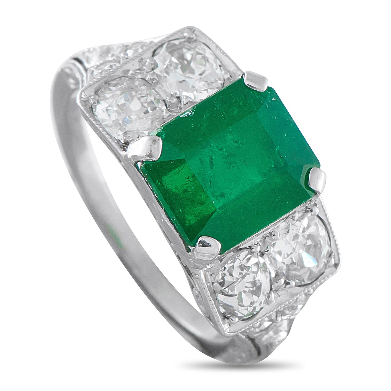 Platinum 1.0ct Diamond and Emerald Ring: This exquisite ring will never go out of style. Diamonds totaling 1.0 carats shine brightly from their place within the intricate Platinum setting. At the center, a stunning 3.20 carat Emerald center