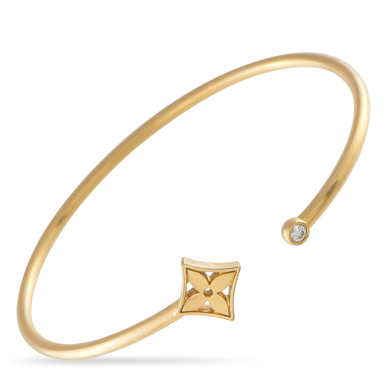 LOUIS VUITTON Blossom 18K Yellow Gold Diamond Bangle: This Louis Vuitton Blossom bangle bracelet will add a subtle touch of luxury to any ensemble. One end of the sophisticated design features the brand’s iconic monogram flower motif. On the other, you