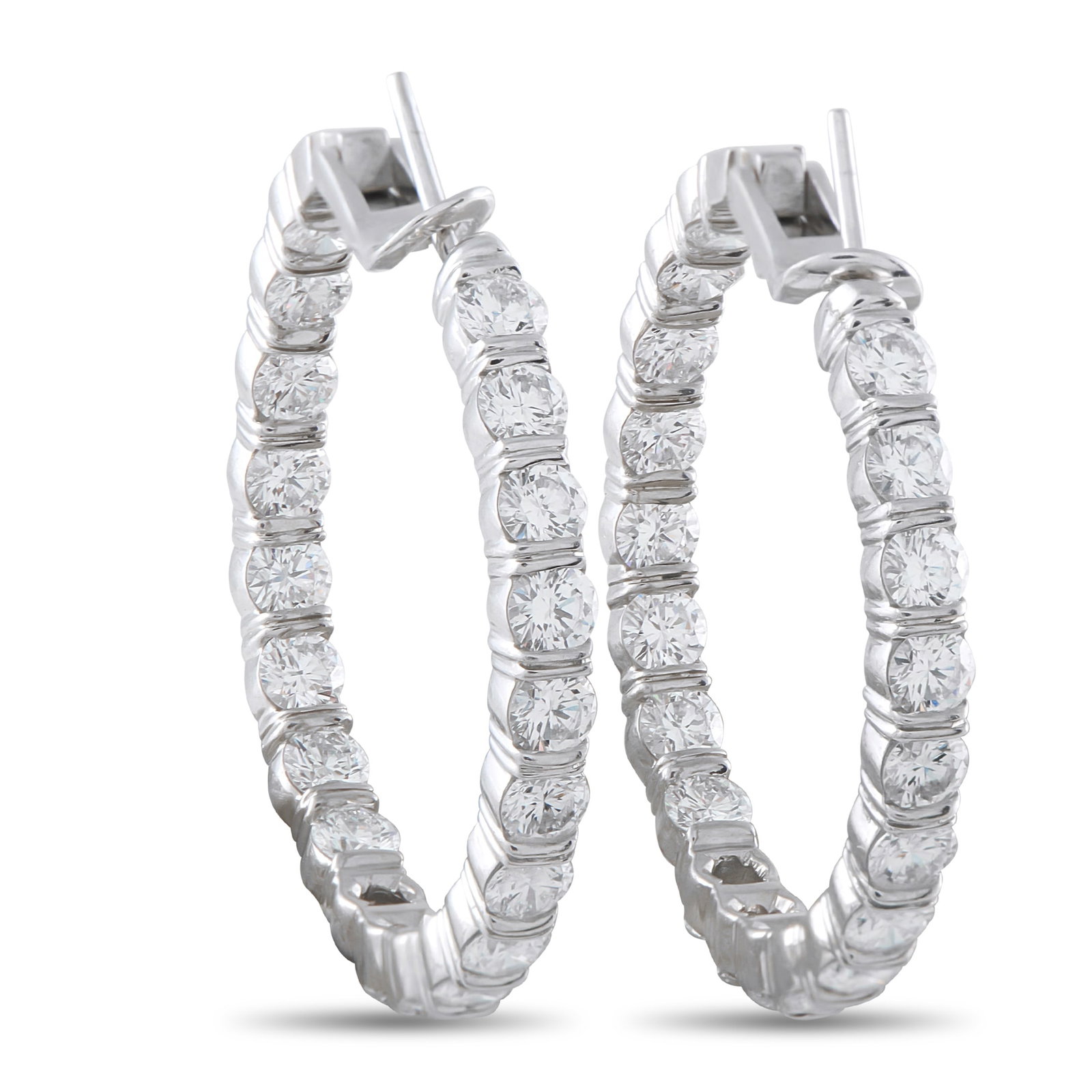 HARRY WINSTON Platinum 6.0ct Diamond Inside-Out Hoop Earrings: Sparkling Diamonds with a total weight of 6.0 carats allow these Harry Winston hoop earrings to effortlessly catch the light every time they’re worn. An elevated take on a classic accessory, the sim