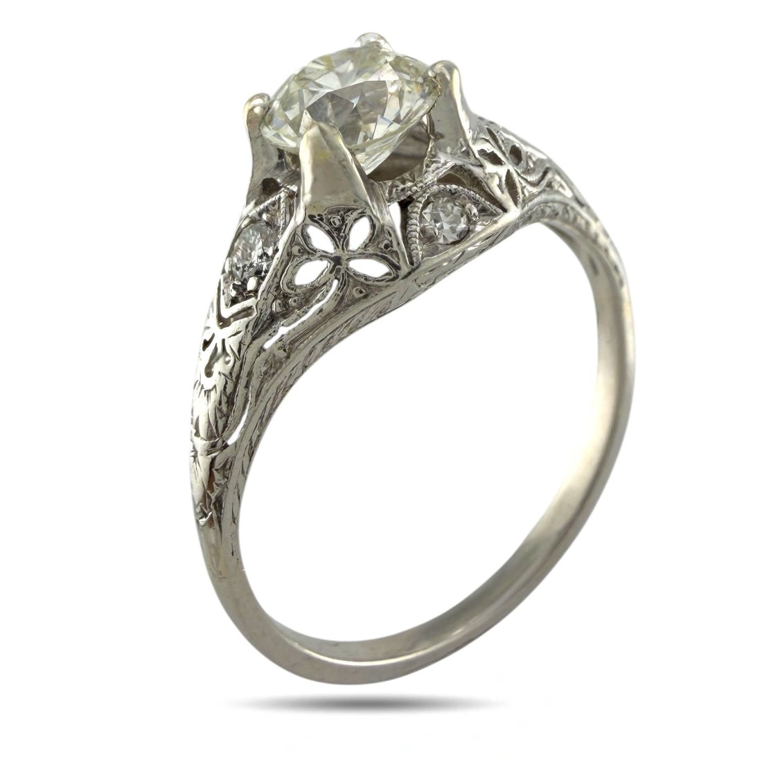 Ring Exclusive Sculpted Platinum 1.03ct Diamond Ring, Platinum - 1.03ct. tw. Diamond (Natural): Exclusive Sculpted Platinum 1.03ct Diamond RingA beautifully crafted platinum ring featuring a central 1.03-carat diamond, elegantly framed by four smaller diamonds that enhance its brilliance. The ba