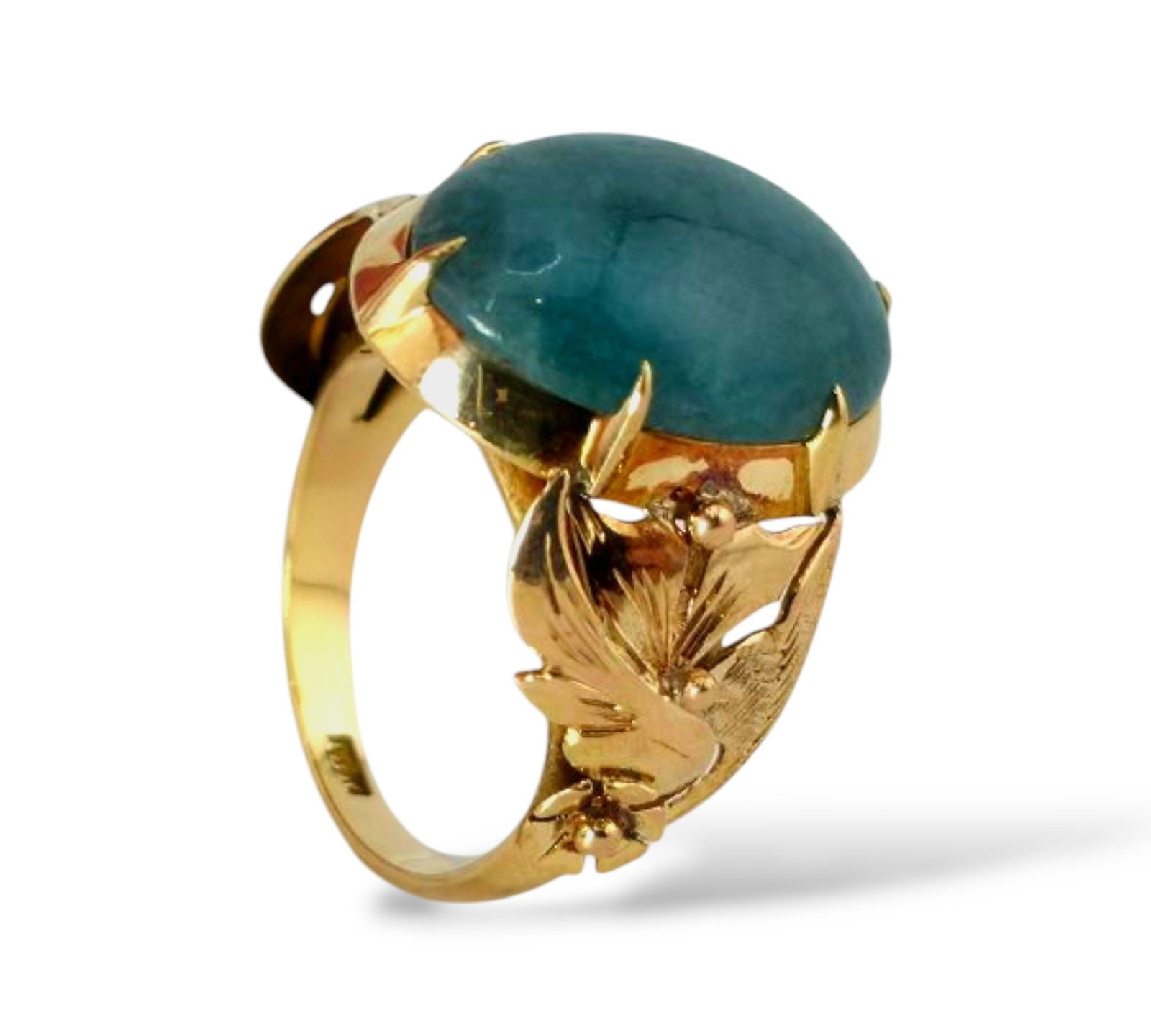 18K Gold Ring with Deep Green Emerald: 18K Gold Ring with Deep Green Emerald This 18K gold ring features a captivating gemstone in a rich, dark green shade with subtle blue-grey undertones. The moody hue of the stone is enhanced by the war