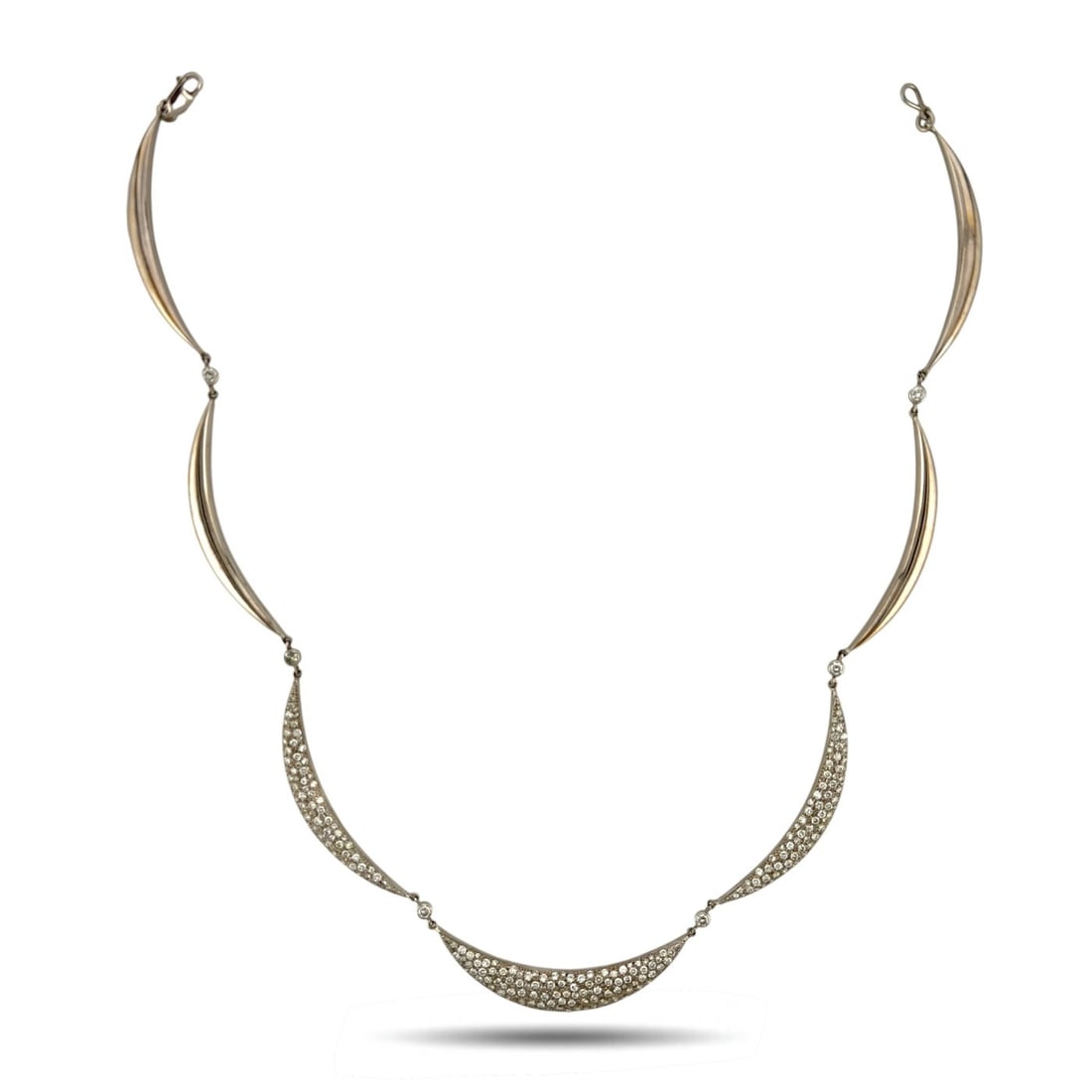 18K White Gold 3.87ct Diamond Crescent Link Necklace: 18K White Gold 3.87ct Diamond Crescent Link Necklace A refined white gold flexible necklace designed with interlocking half crescent moon links, each joined by diamond accents for a graceful flowing s
