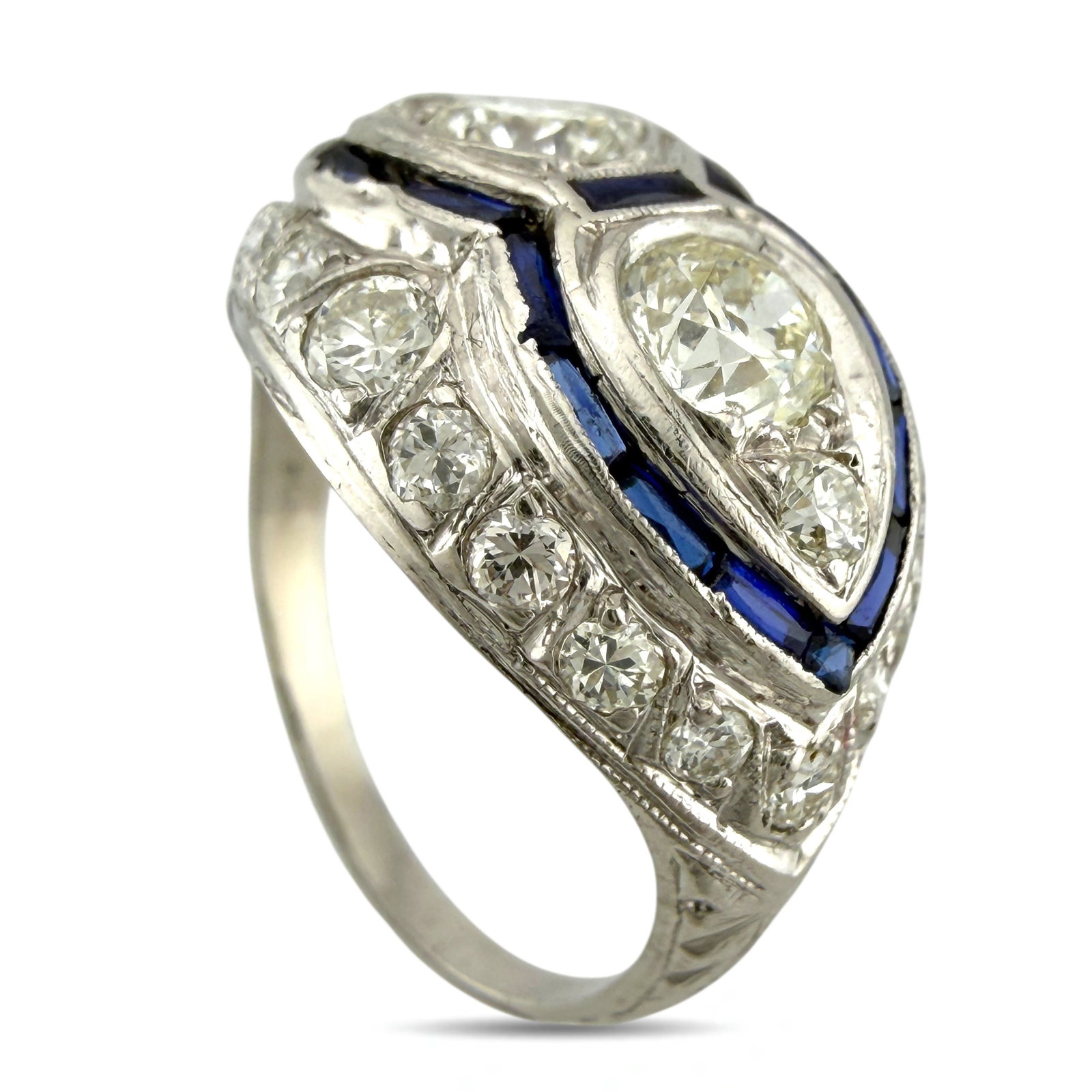 Platinum Art Deco Ring with 1.6ct of Diamonds and Sapphires: Platinum Art Deco Ring with 1.6 Carats of Diamonds and Sapphires This elegant platinum Art Deco ring captures the spirit of its era with a striking interplay of geometric form and vibrant color. At it