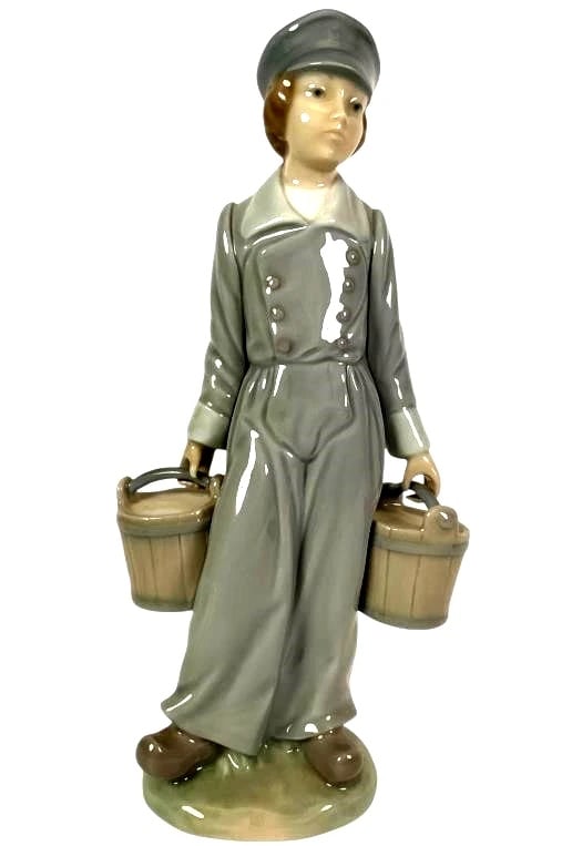 LLADRO BOY WITH PAILS 1972-88 PORCELAIN FIGURINE 4811G: LLADRO BOY WITH PAILS 1972-88 PORCELAIN FIGURINE 4811GPorcelain figurine by Lladro titled 'Dutch Boy with Pails,' model number 4811. Measures 8 inches tall. The figure, crafted in Spain, depicts a boy
