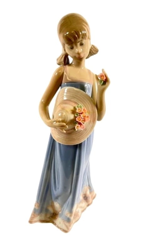 Lladro Girl with Flowered Hat 5648 Porcelain Figurine: Lladro Vintage Limited Edition Girl with Flowered Hat 5648Lladro porcelain figurine titled Girl with Flowered Hat, model #5648. Measures approximately 8.25 inches tall. Features a young girl in a blue