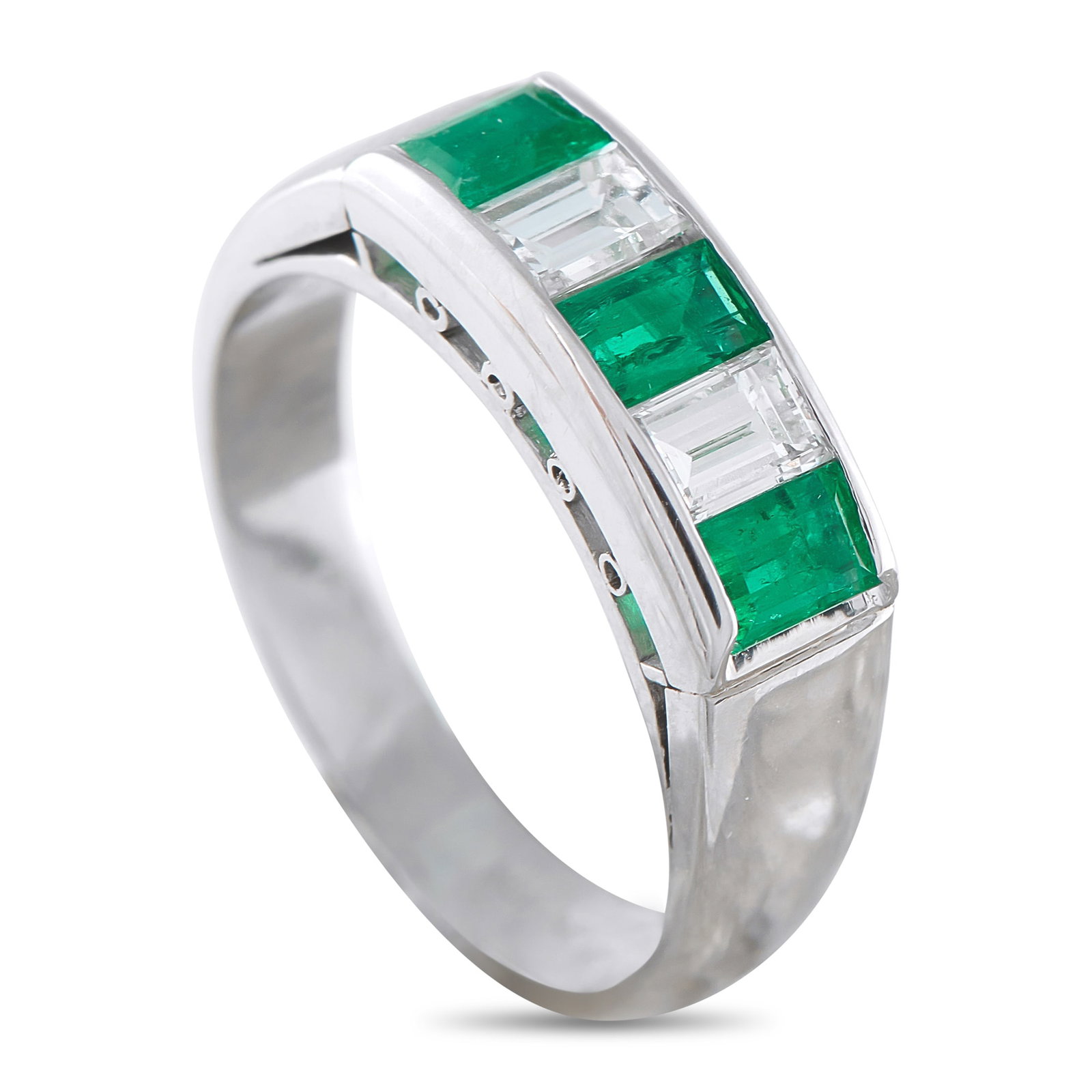 Platinum 0.45ct Diamond and Emerald Ring: This radiant ring offers a sleek sense of sophistication. Sparkling Diamonds with a total weight of 0.45 carats alternate with Emeralds totaling 0.56 carats at the top of the design. Set in Platinum, 
