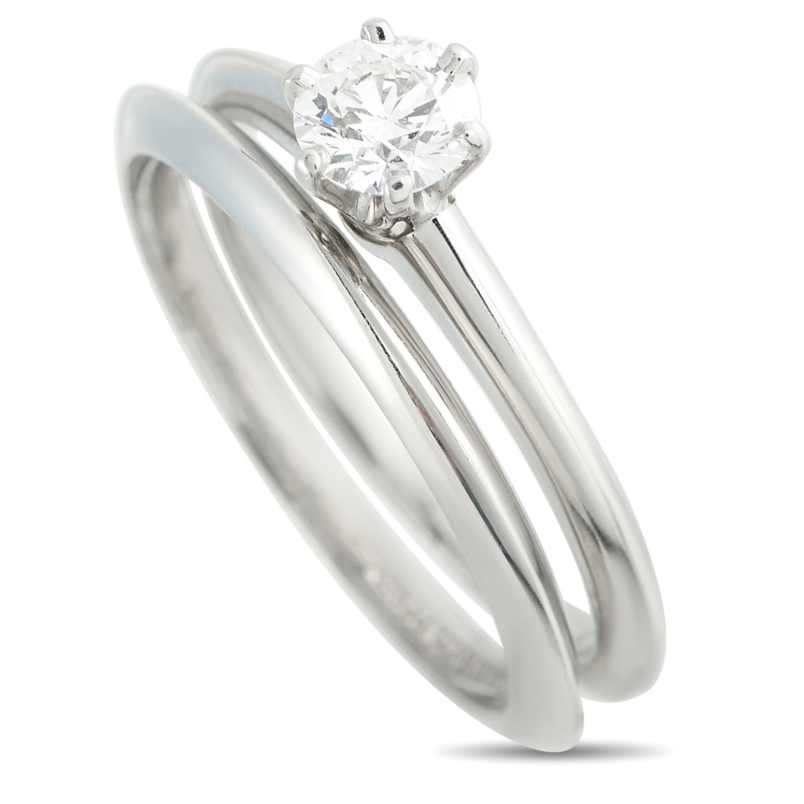 TIFFANY & CO. Tiffany & Co. Platinum 0.45ct Diamond Ring: This Tiffany & Co. ring set is ideal for anyone who appreciates timeless luxury. This two-piece set comes complete with a Platinum ring featuring a 0.45 carat Diamond center stone and a matching Plati