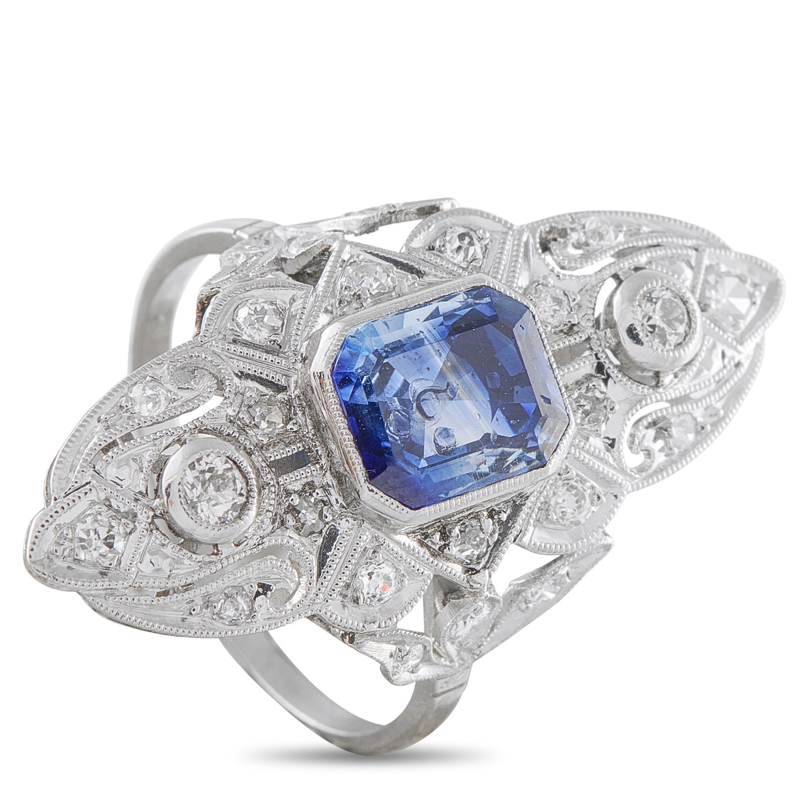 Platinum 0.40ct Diamond and Sapphire Ring: Ornate details make this luxury ring instantly captivating. Diamonds with a total weight of 0.40 carats elevate the detailed Platinum setting. At the center, a 2.0 carat Sapphire adds a stylish pop of