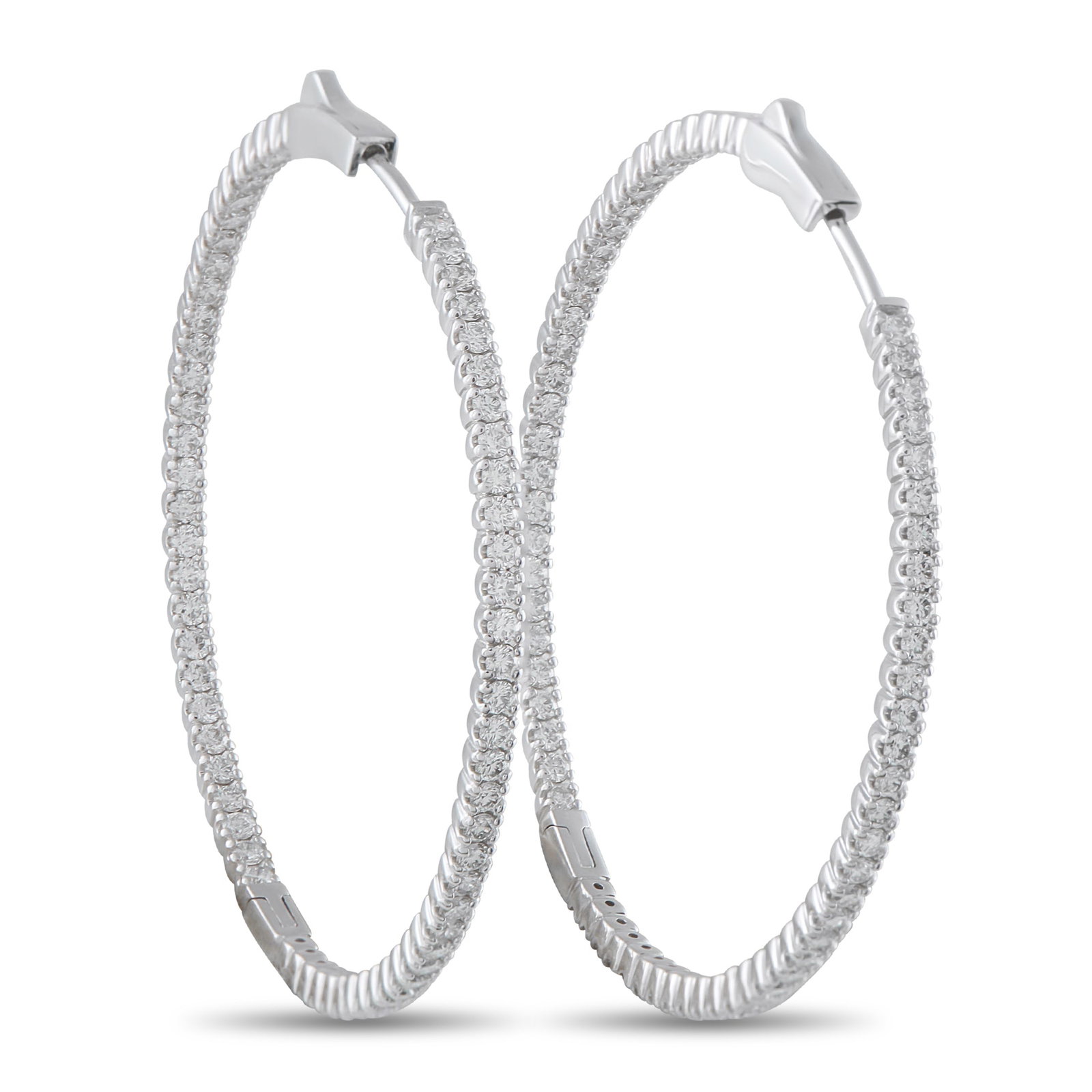 14K White Gold 2.02ct Diamond Inside-Out Hoop Earrings: These dazzling hoop earrings will put the perfect finishing touch on any ensemble. Sleek and stylish, the classic design comes to life thanks to sparkling Diamonds with a total weight of 2.02 carats. 