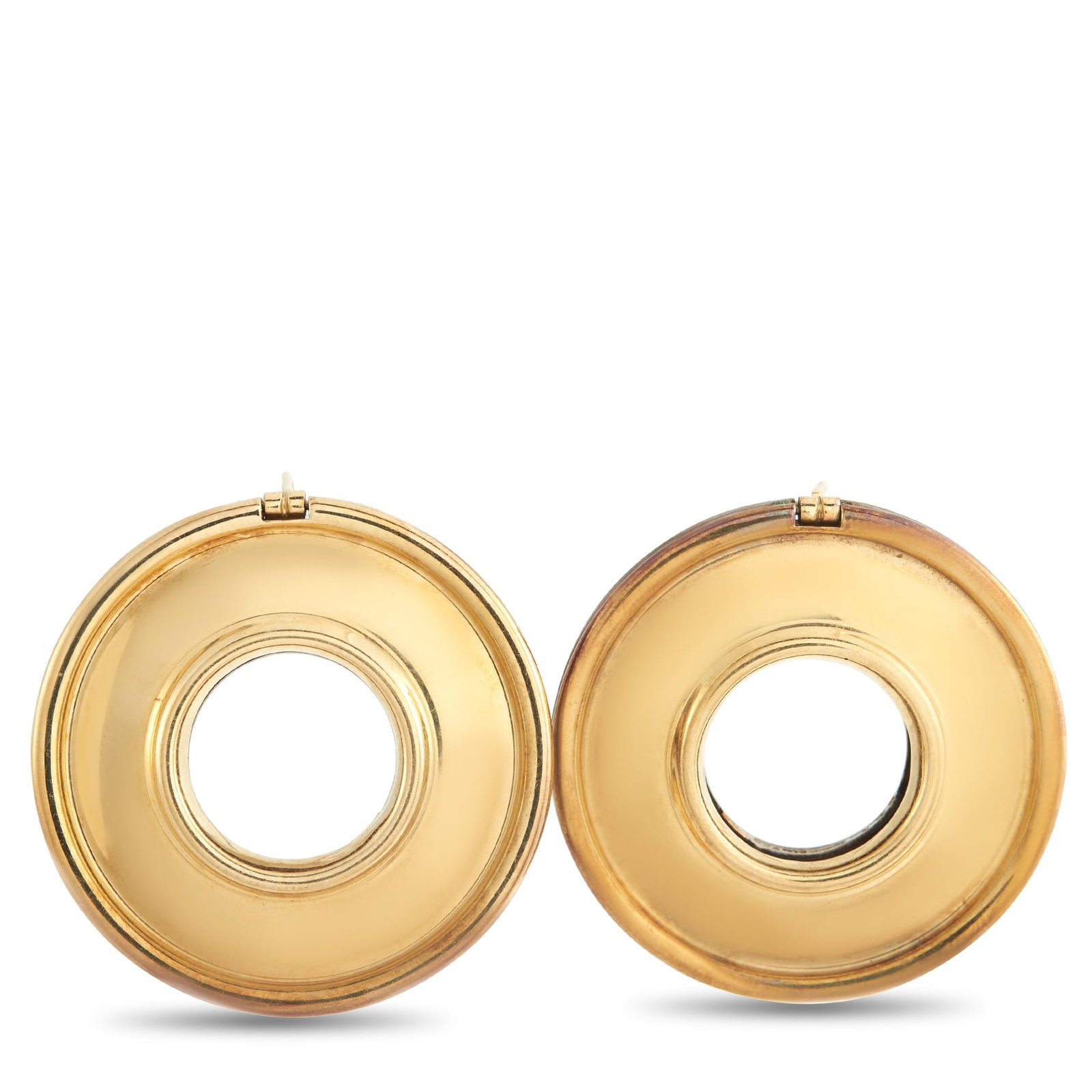TIFFANY & CO. Tiffany & Co. Paloma Picasso 18K Yellow Gold and Silver Reversible Earrings: A reversible design allows these Tiffany & Co. Paloma Picasso earrings to complement any outfit. One side of the circular setting features lustrous 18K Yellow Gold, while the other side is crafted fro