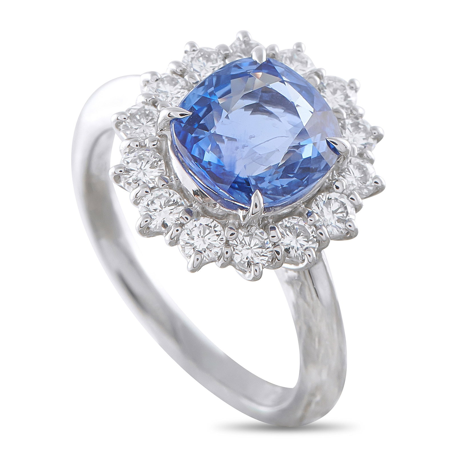 Platinum 0.78ct Diamond and Sapphire Ring: A timeless design makes this luxury ring an instant classic. Set in Platinum, it features a 3.67 carat Sapphire center stone surrounded by a halo of Diamonds totaling 0.78 carats. A 2mm wide band and 