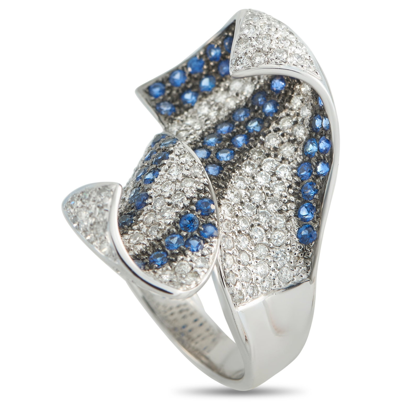 18K White Gold 1.26ct Diamond and Sapphire Ring: Curved lines and a dramatic 18K White Gold setting ensure this ring is exquisite from every angle. Chic and incredibly contemporary, Sapphires with a total weight of 2.50 carats are perfectly paired w