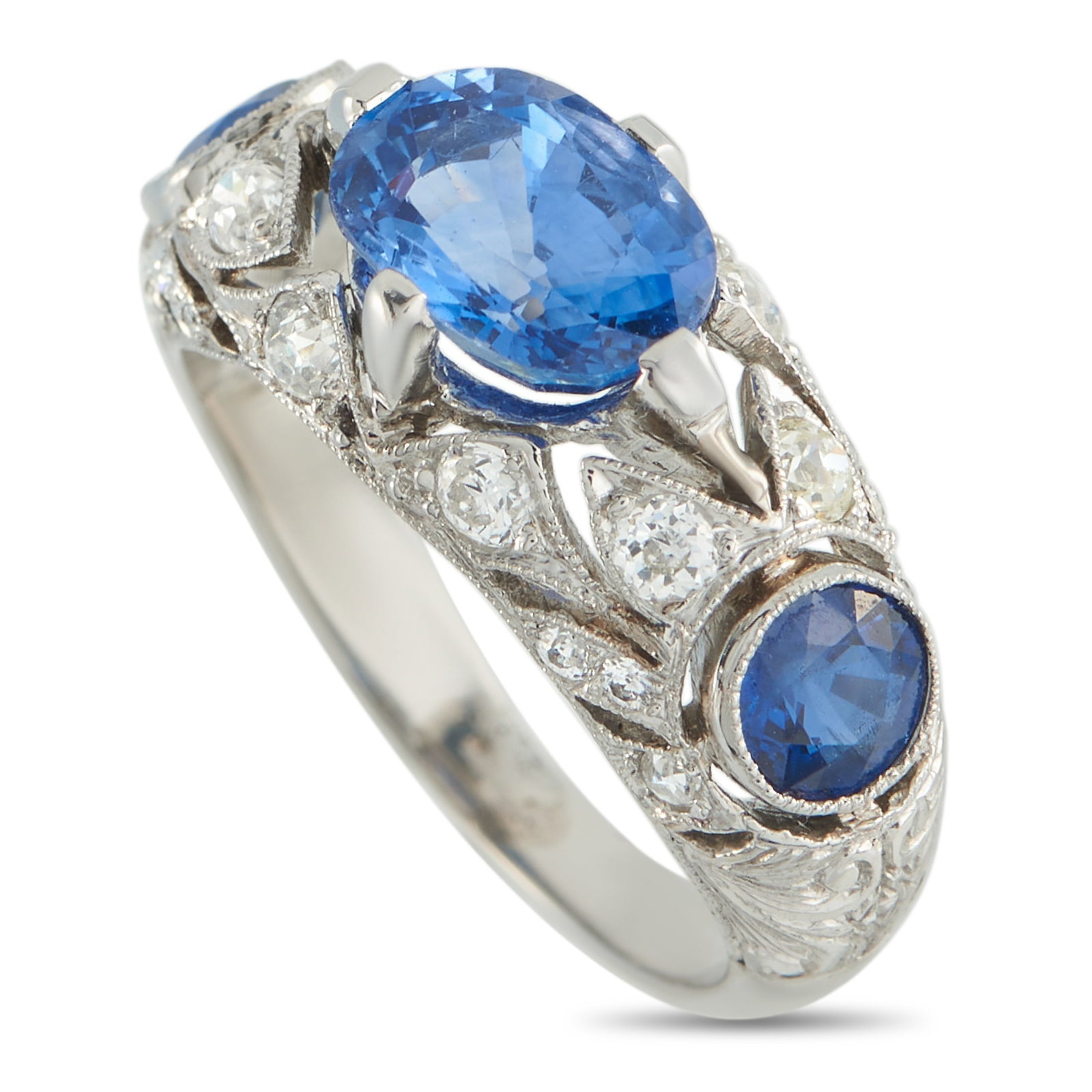18K White Gold 0.40ct Diamond and Sapphire Ring: An Exclusive piece that offers more to see with every wear. It features a 2.40-carat oval sapphire sitting at the center in prongs, elevated above a domed white gold band. Two bezel-set round sapphire