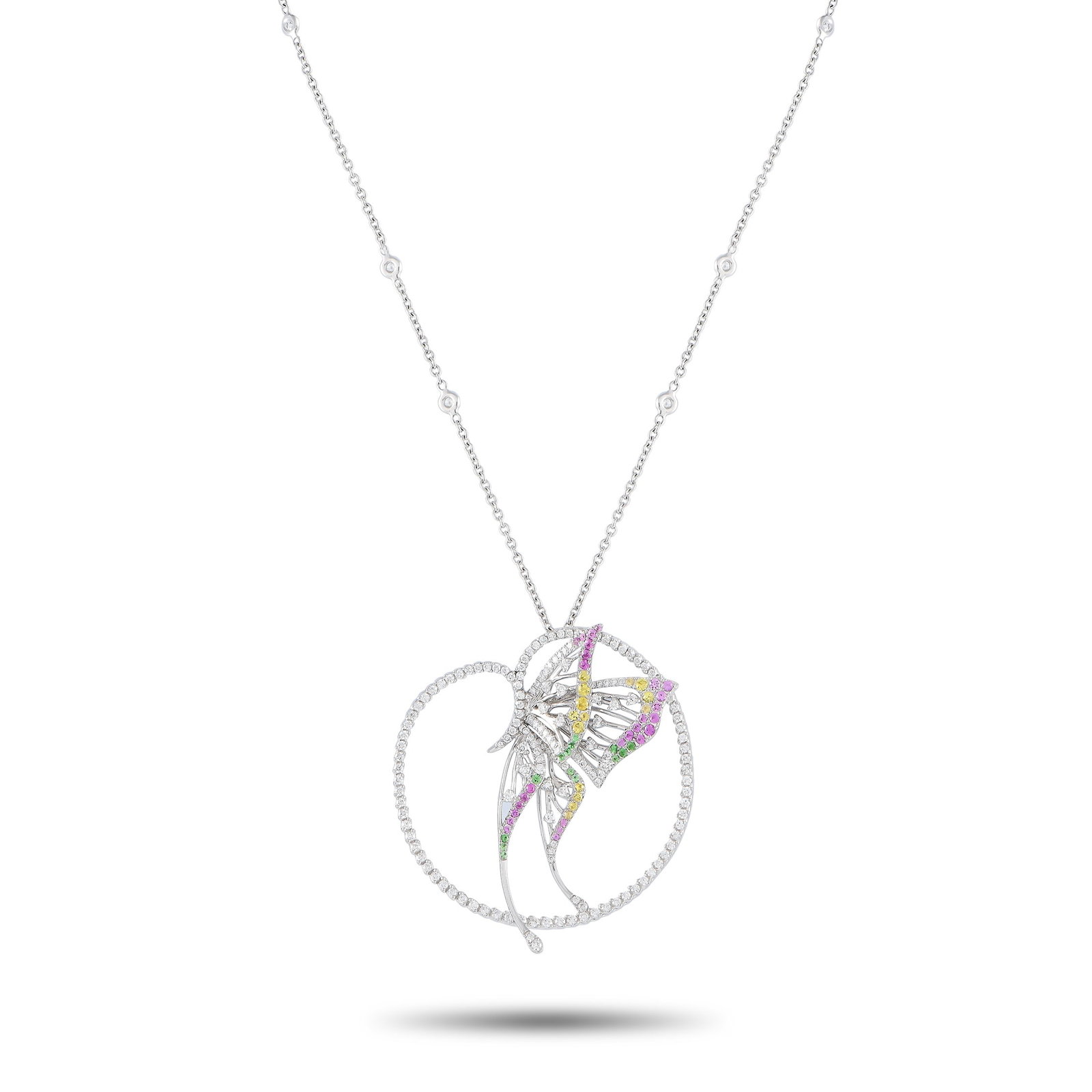 BUCHERER 18K White Gold 2.20ct Diamond, Sapphire and Tsavorite Butterfly Necklace: Trust us, this Bucherer necklace can elevate your style to new heights. Rendered in white gold, this beautiful piece carries a slim chain with a captivating butterfly pendant. The delicate-looking pap