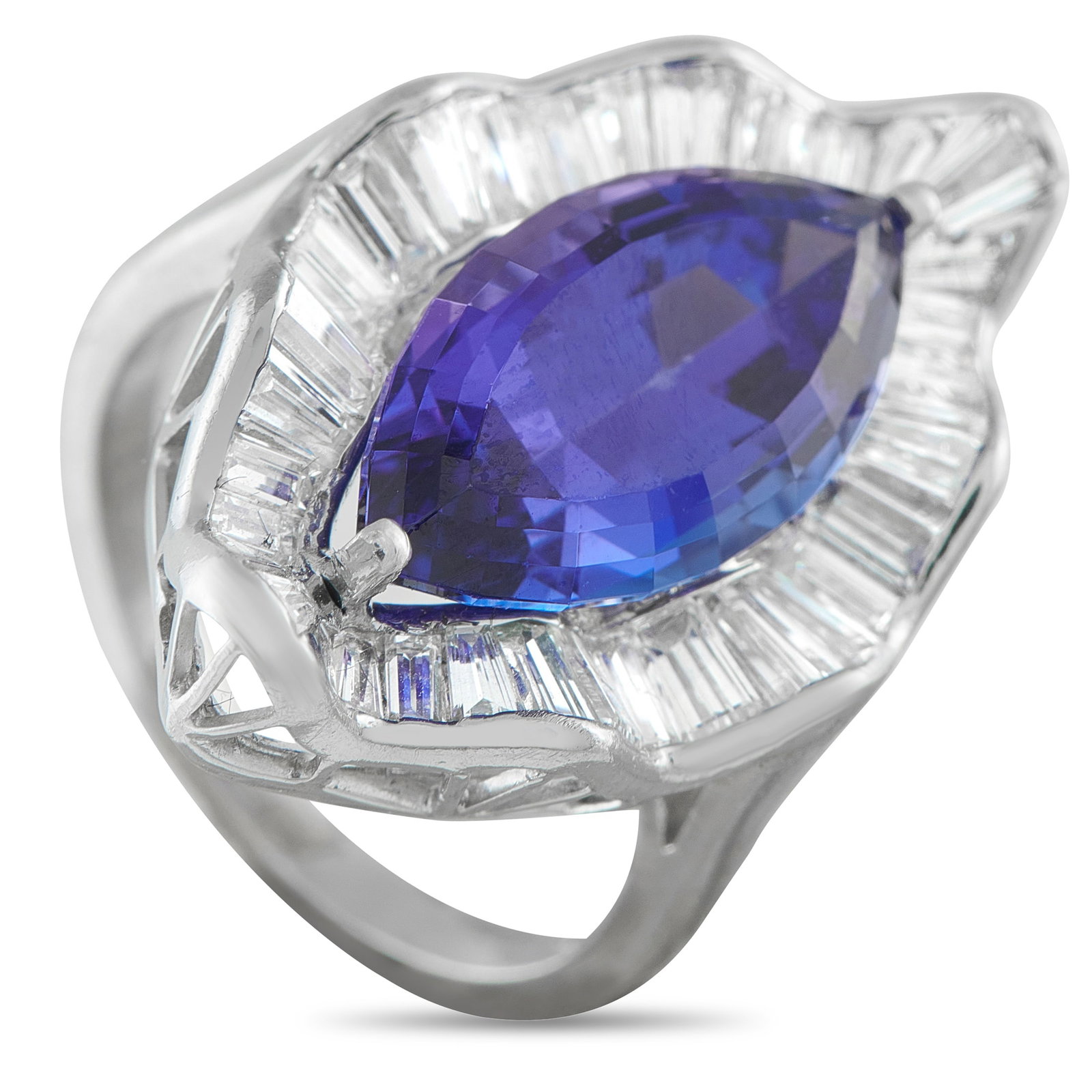 Platinum 1.80ct Diamond and Tanzanite Ring: A delicate Platinum setting showcases this ring’s elegant array of sparkling gemstones. At the center, a 7.37 carat blue Tanzanite makes this piece incredibly eye-catching. Diamond baguettes with a