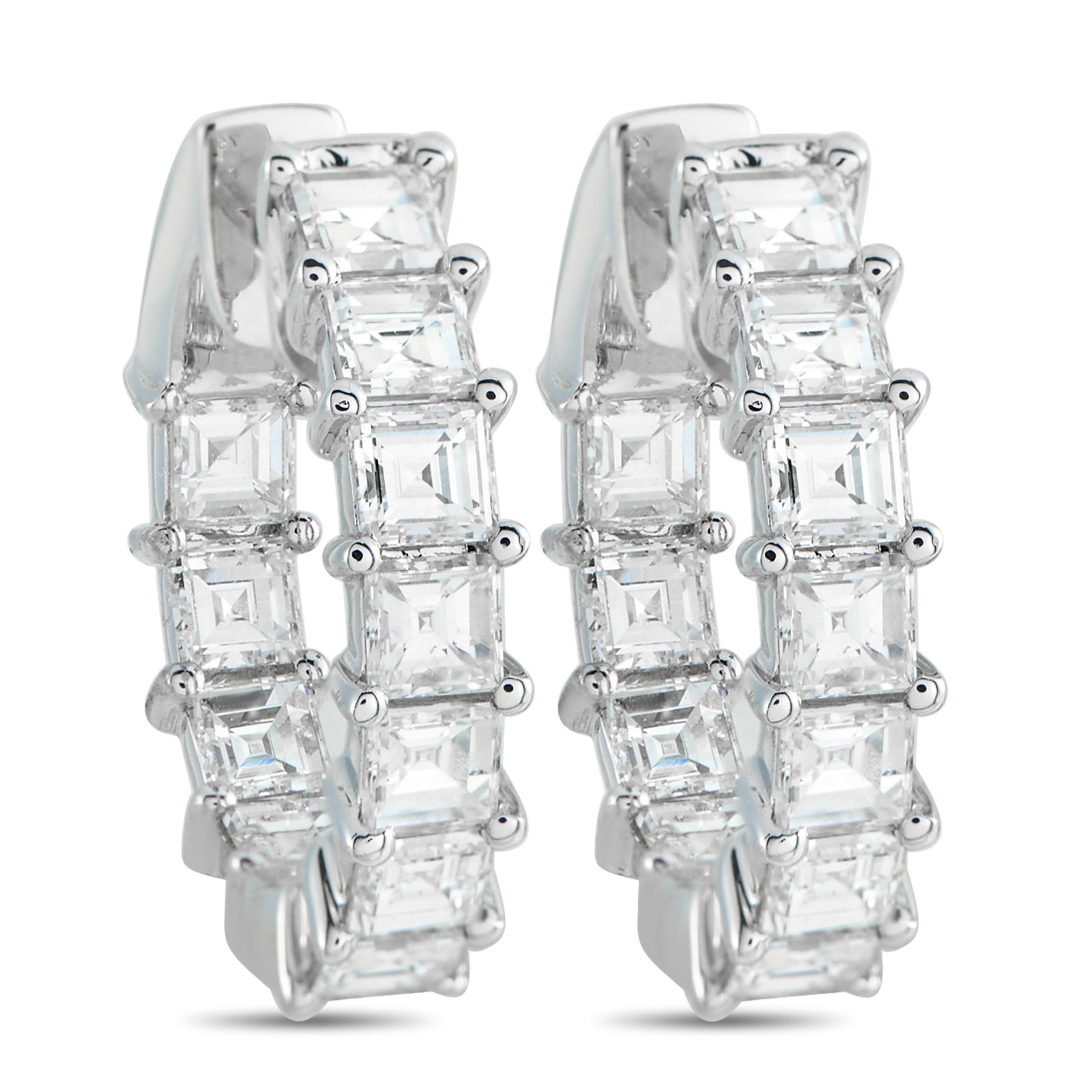 18K White Gold 3.25ct Diamond Inside-Out Hoop Earrings: Set with carré-cut diamonds in shared prongs, these 0.75-inch inside-out hoop earrings look visually strong even with their compact size. Each diamond is square and sharply faceted, with the concentr