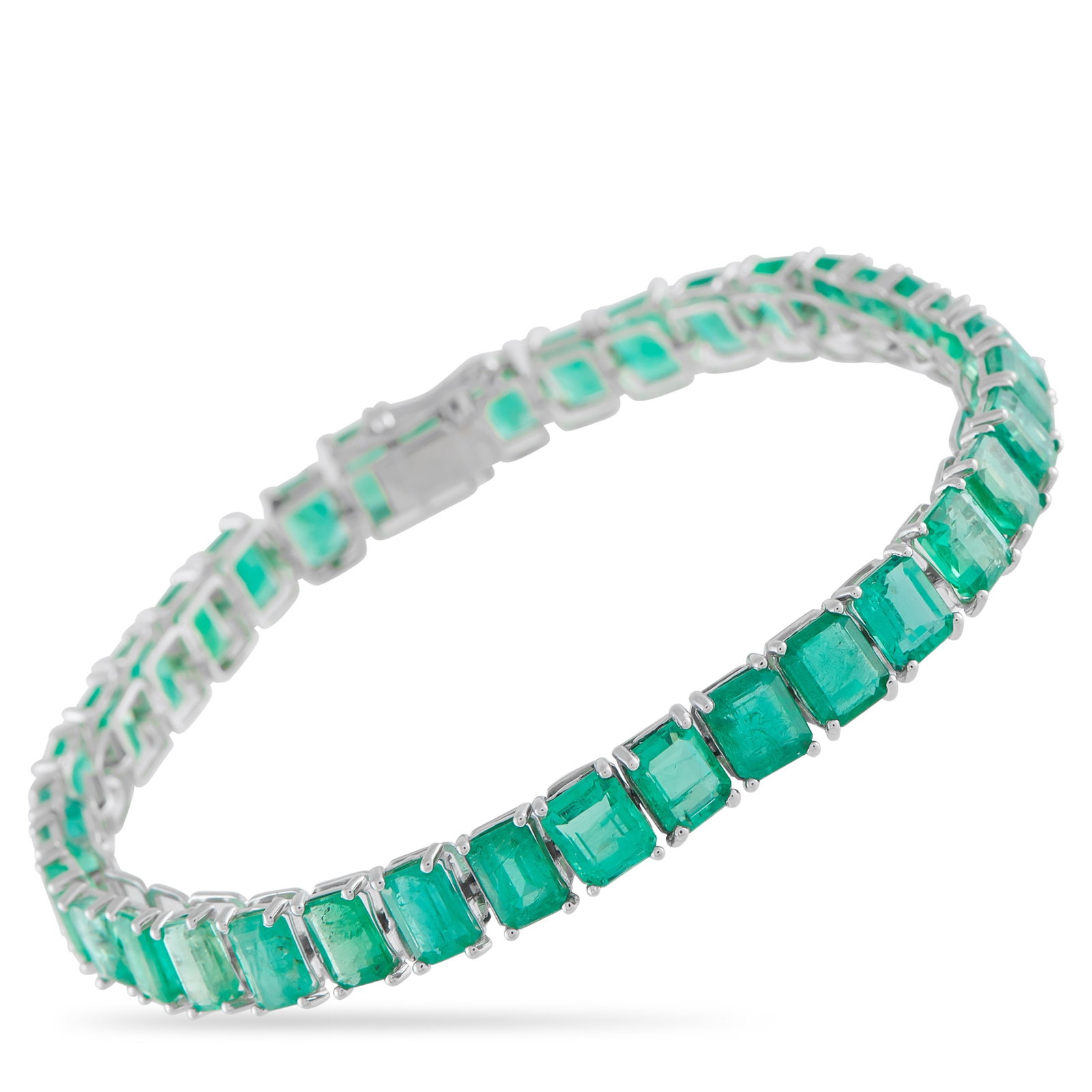 Platinum 26.87ct Emerald Line Bracelet: This exquisite line bracelet will instantly add a pop of color to any ensemble. Incredibly opulent, the simple Platinum setting showcases a series of Emeralds totaling 26.87 carats. It measures 7.5&rd