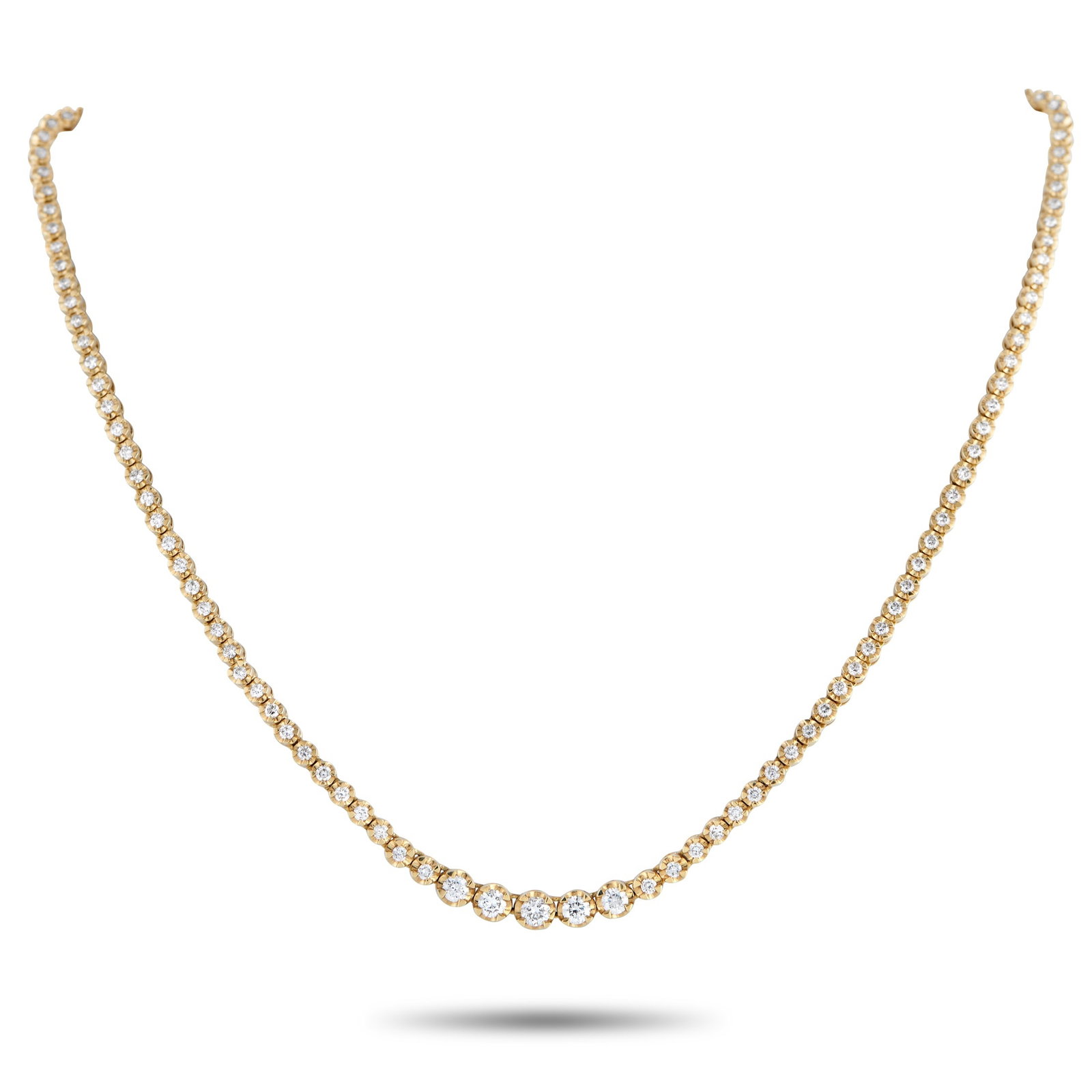 18K Yellow Gold 3.0ct Diamond Line Necklace: Rather than following the standard tennis necklace layout, this 18K yellow gold diamond line necklace introduces a point of emphasis at its center. A short row of larger diamonds forms the focal point