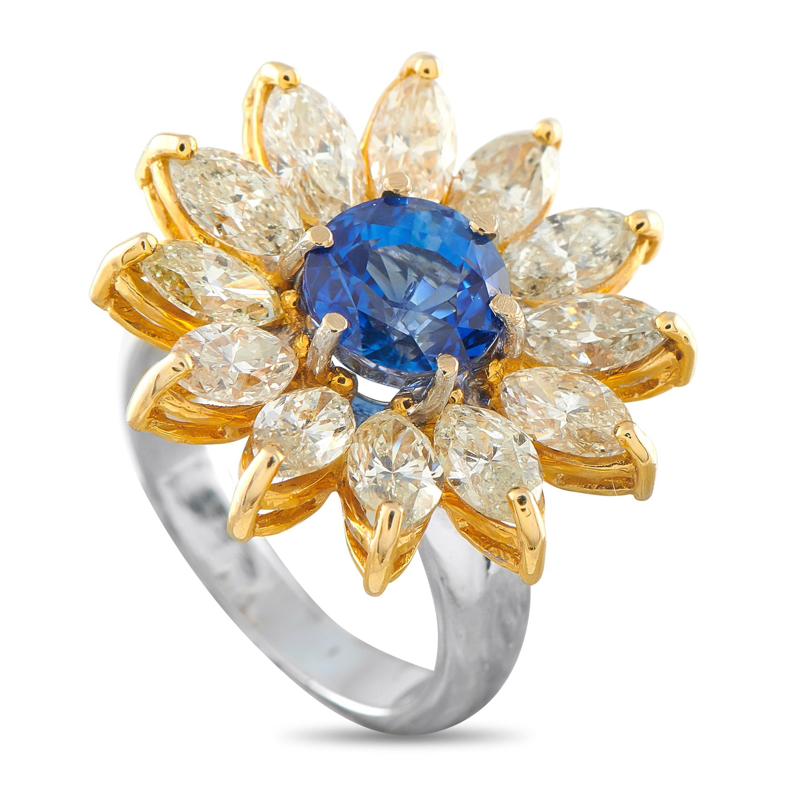 18K Yellow Gold 4.55ct Diamond and Sapphire Ring: A vibrant 3.19 carat Sapphire makes a statement at the center of this ring’s breathtaking floral motif. Crafted from 18K Yellow Gold, marquise-cut Diamonds totaling 4.55 carats surround the center s