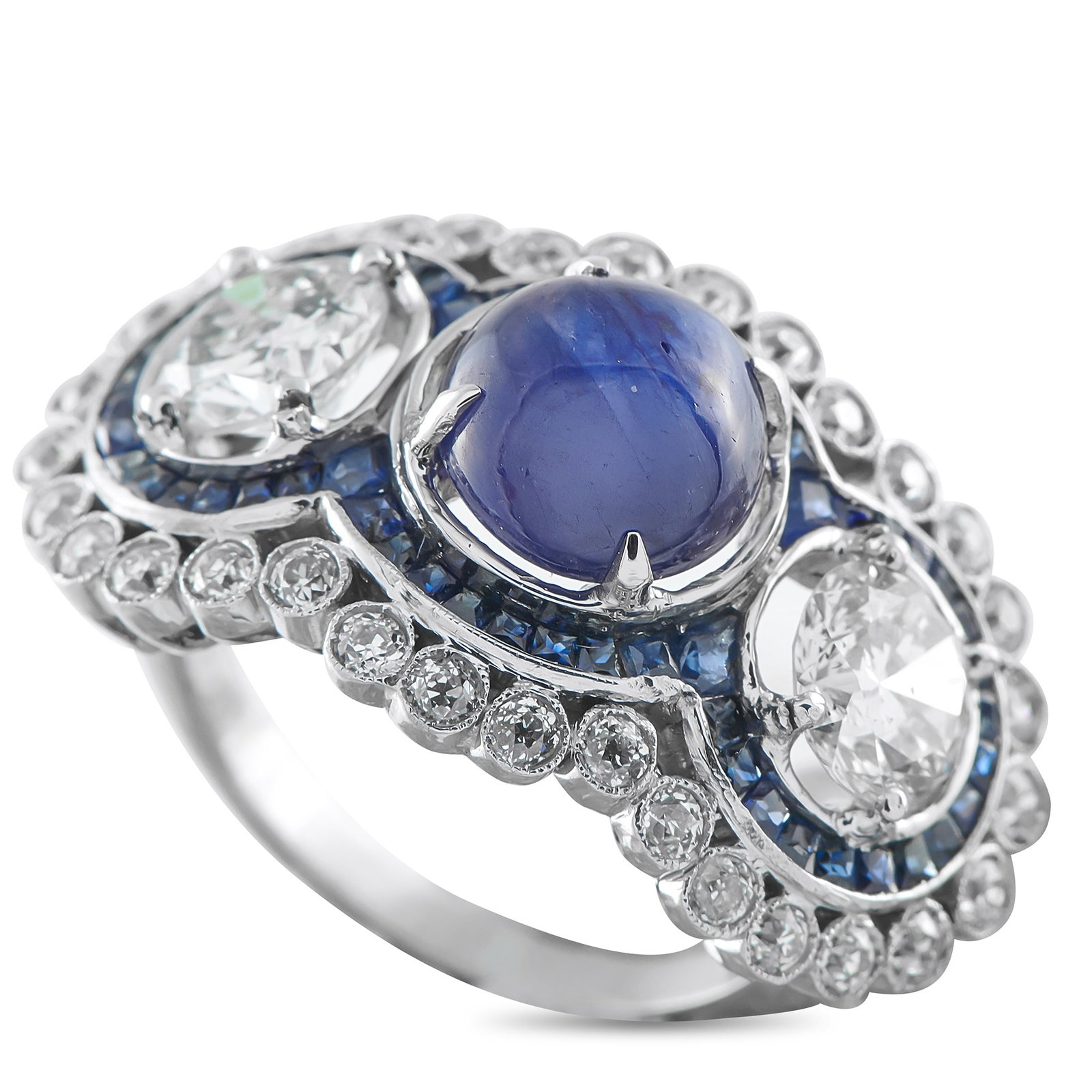 Platinum 2.10ct Diamond and Sapphire Ring: This luxury ring exudes old fashioned opulence. At the top, Sapphires with a total weight of 3.25 carats add a dramatic pop of color. Two 1.0 carat Diamonds anchor each side of the design, while addit