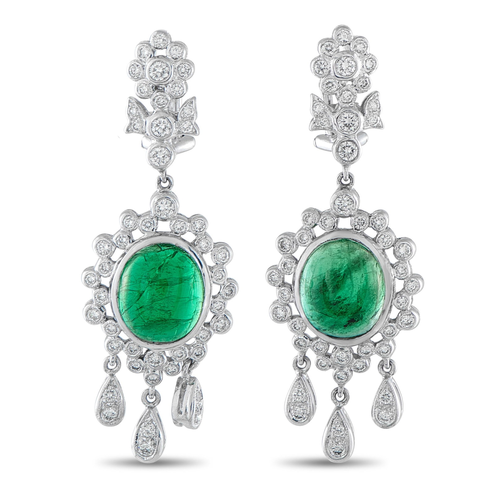18K White Gold 1.10ct Diamond and Emerald Earrings: These intricate earrings will add a touch of luxury to any outfit or occasion. The delicate 18K White Gold settings showcase sparkling Diamonds with a total weight of 1.10 carats. At the center, Emera