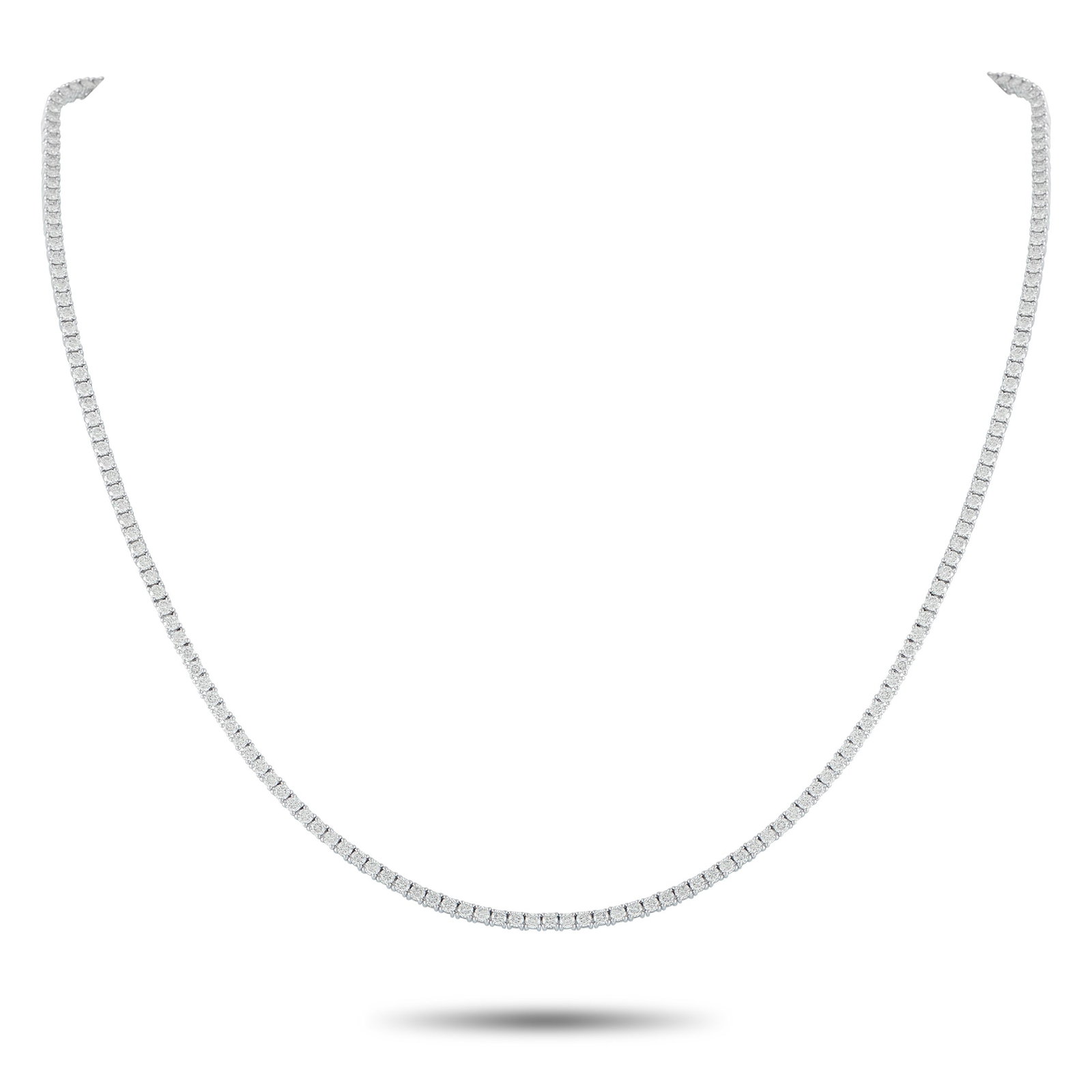 18K White Gold 5.92ct Diamond Tennis Necklace: Add a subtle touch of luxury to any ensemble with this classic tennis necklace. The elegant, understated design shines to life thanks to a series of Diamonds totaling 5.92 carats. Set in 18K White
