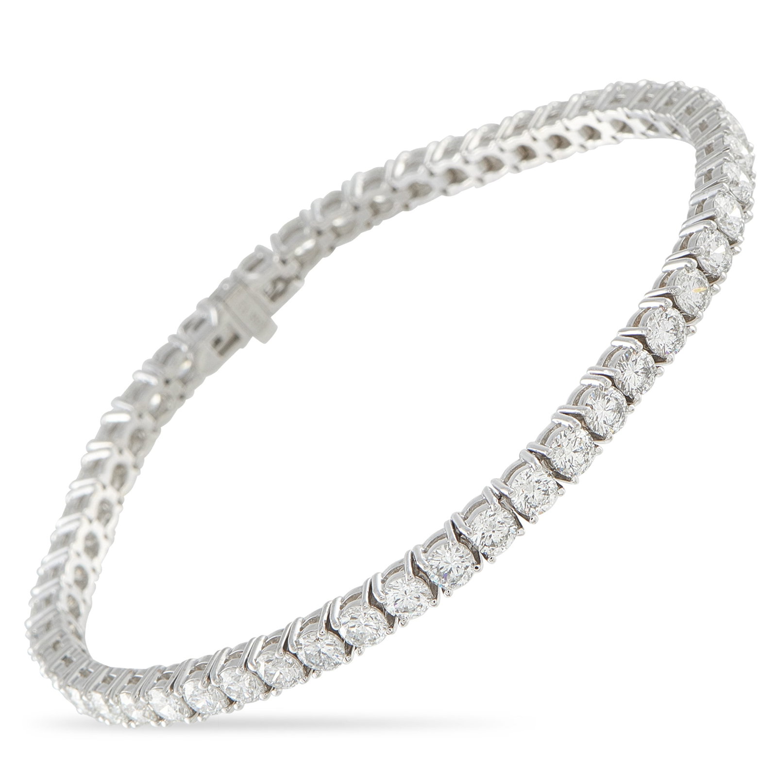 18K White Gold 8.26ct Diamond Tennis Bracelet: Add a touch of timeless luxury to any ensemble with this tennis bracelet. The simple 18K White Gold setting beautifully showcases sparkling Diamonds with a total weight of 8.26 carats. It measures