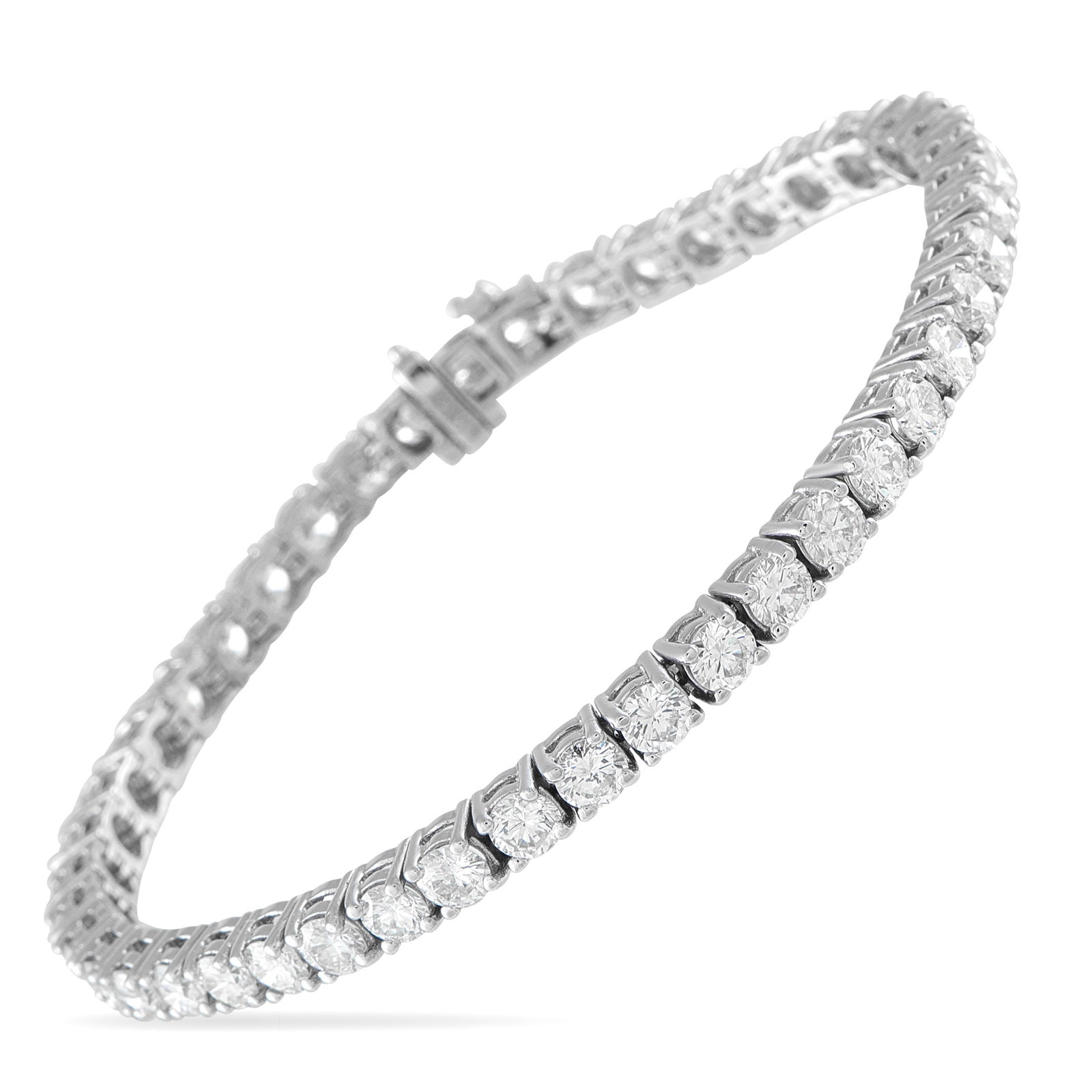 18K White Gold 9.25ct Diamond Tennis Bracelet: This classic tennis bracelet offers the perfect touch of quiet luxury. Set in 18K White Gold, a series of round-cut Diamonds totaling 9.25 carats allow it to effortlessly sparkle and shine. It measure