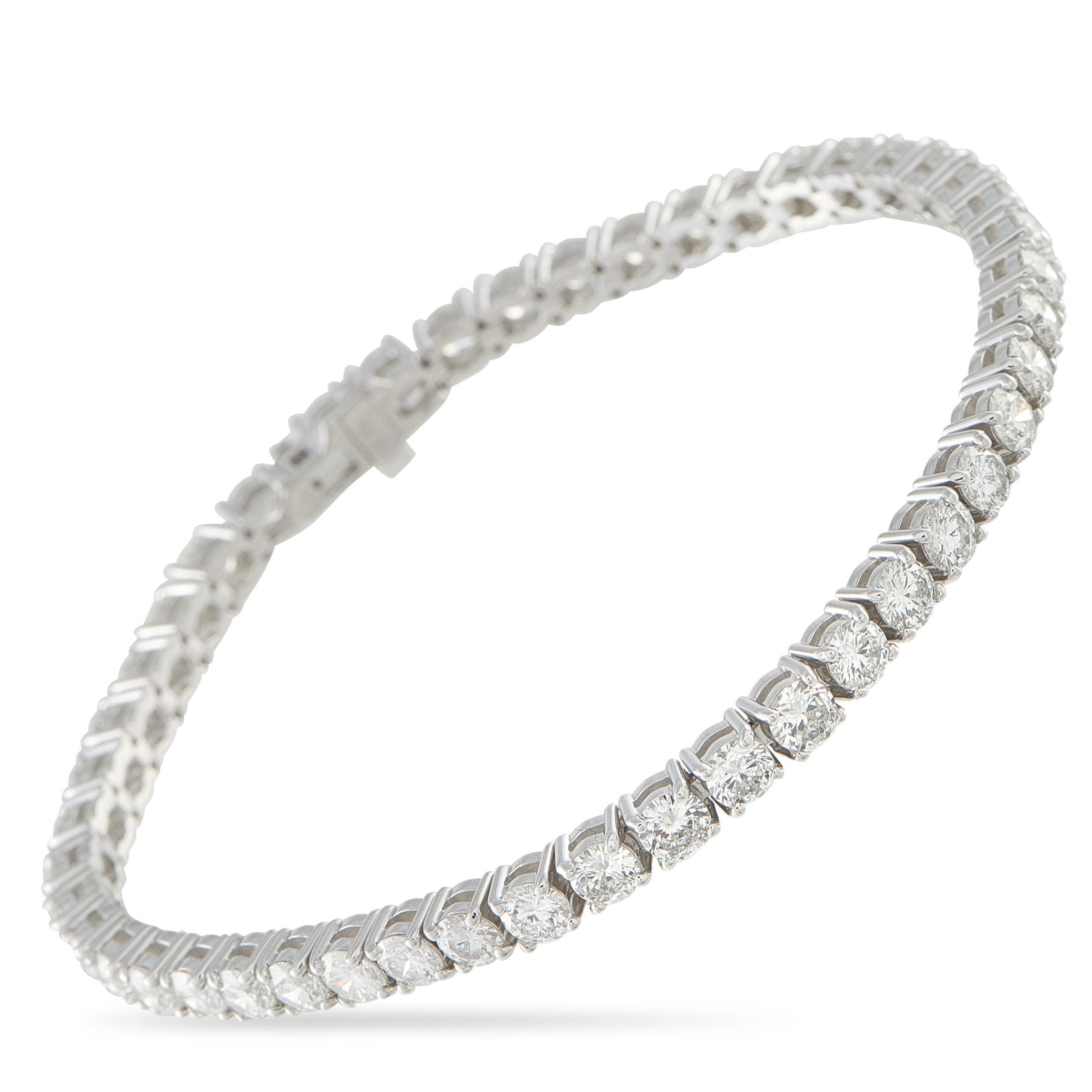 18K White Gold 9.26ct Diamond Tennis Bracelet: A series of sparkling round-cut Diamonds totaling 9.26 carats make this tennis bracelet simply unforgettable. The timeless design is crafted from 18K White Gold and measures 7.25” long. Metal - 