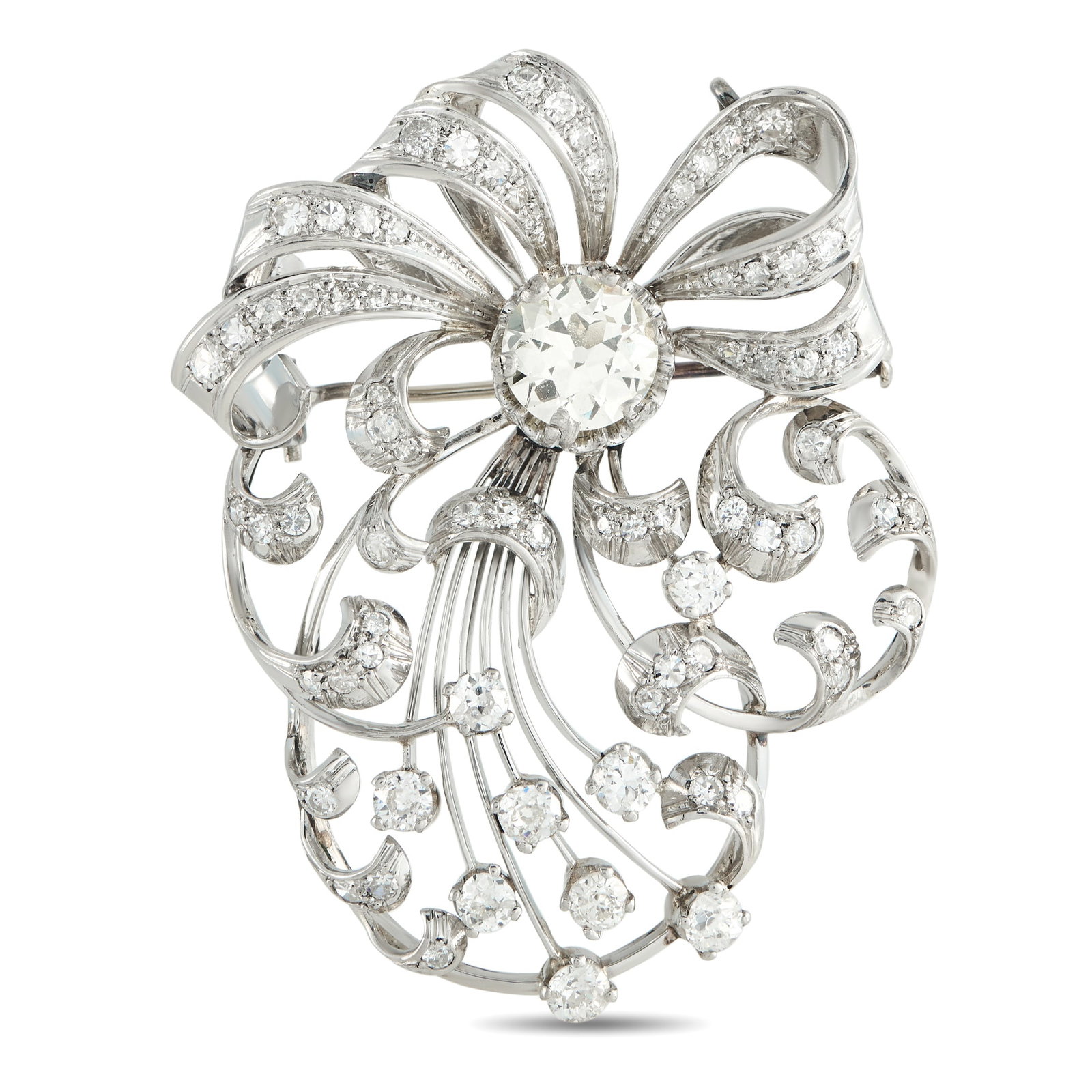Platinum 4.07ct Diamond Victorian Spray Brooch: A spray of shine and sheen defines this Victorian-inspired brooch in platinum. At the core sits a 2.07-carat center diamond, from which curling diamond-set ribbons emerge. A few rigid platinum stems a